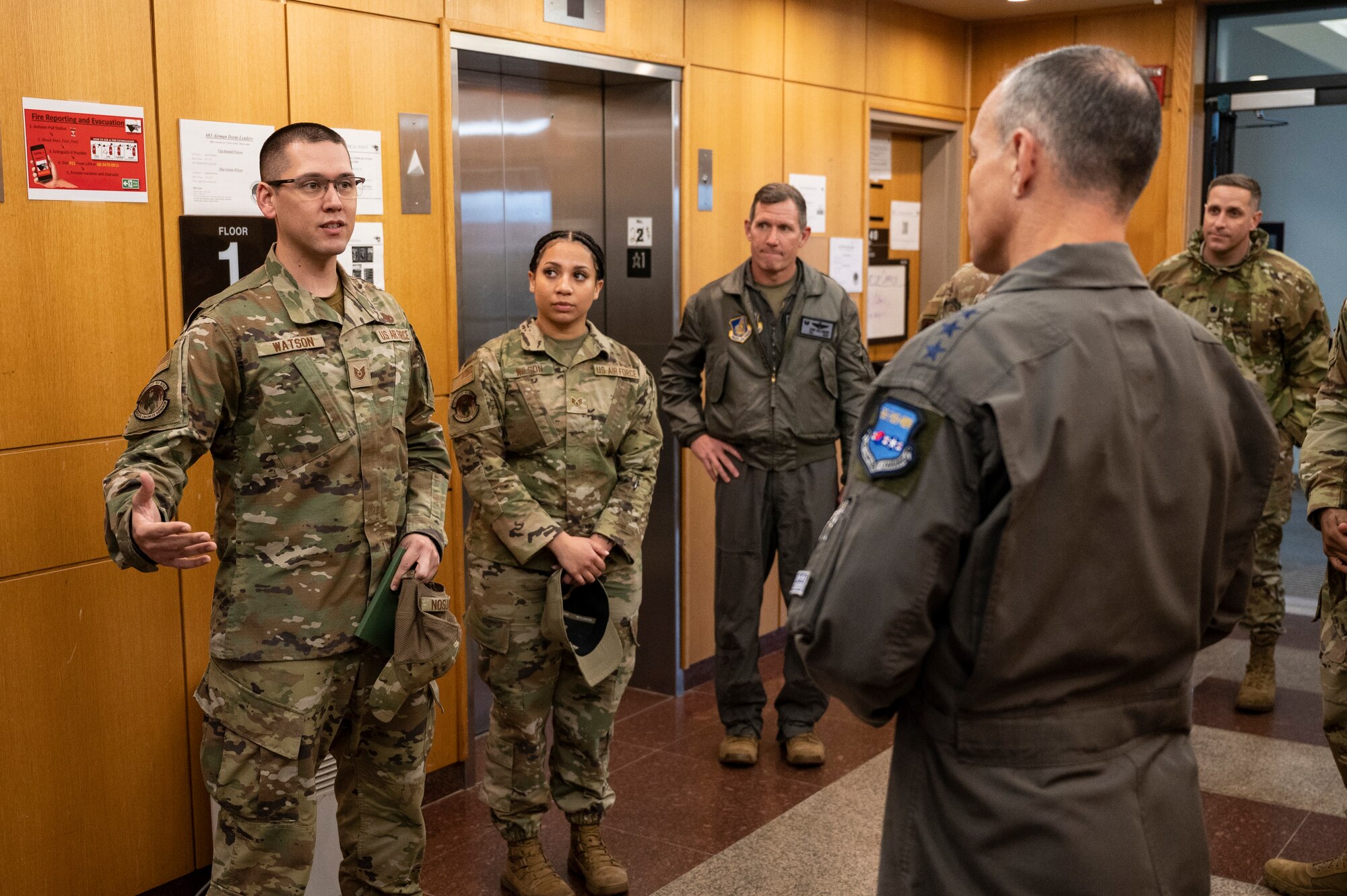 Tech. Sgt. Randall Watson, 8th Civil Engineer Squadron Airman Dorm Leader, talks about the 8th Fighter Wing’s capability to accept follow-on forces with Lt. Gen. Scott Pleus, Seventh Air Force commander, at Kunsan Air Base, Republic of Korea, Nov. 10, 2021.