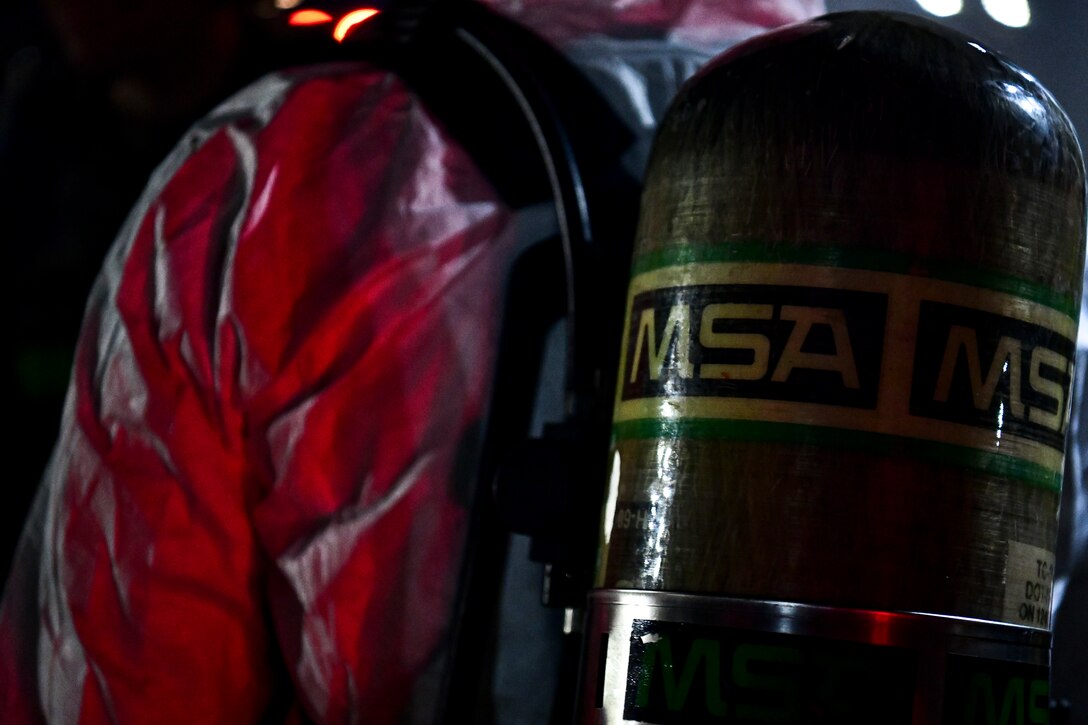 A maintainer dons his gear.