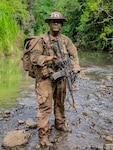 NCO stands in Hawaiian river bed