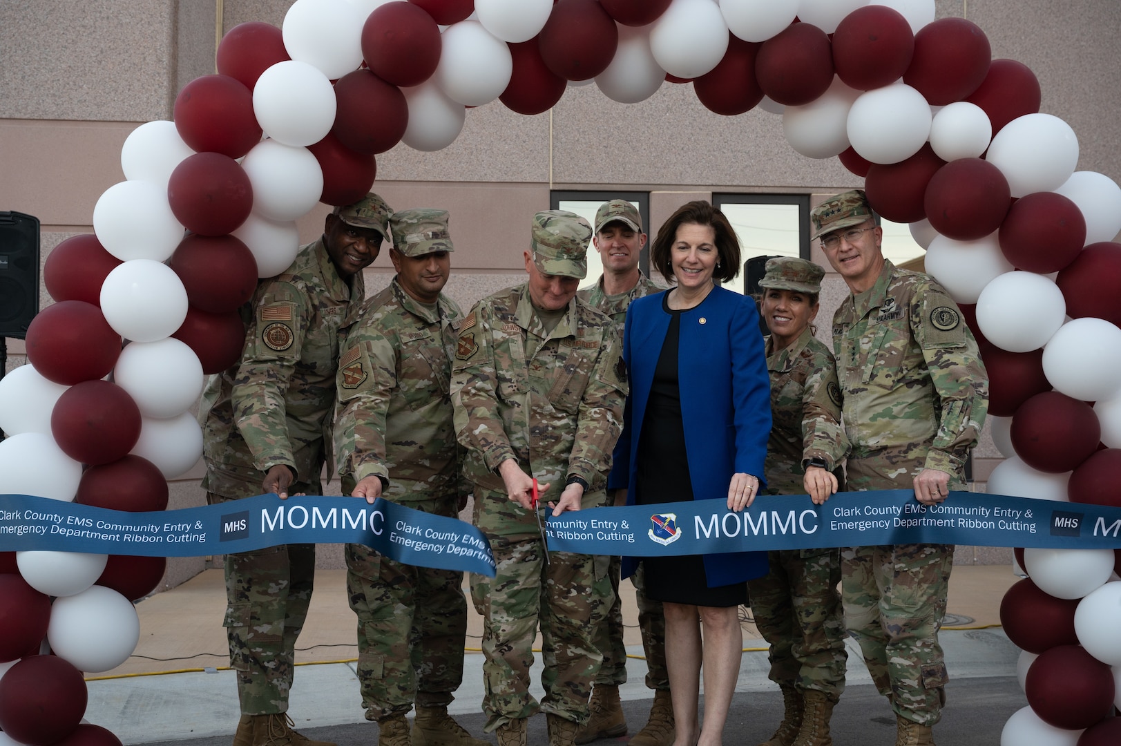 People cutting ribbon