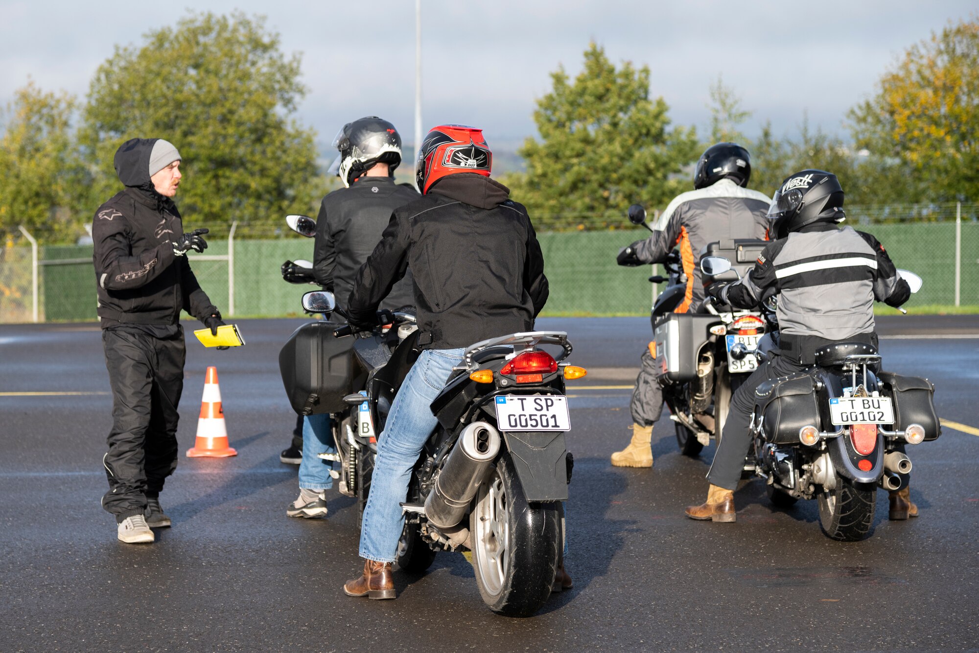 A rider coach for the Motorcycle Safety Foundation Rider Coach Trainer course prepares prospective rider coaches for an obstacle course on Spangdahlem Air Base, Germany, Oct. 22, 2021. The course stresses being a lifelong learner and aims to send both students and coaches away knowing that they can always improve their riding skills. (U.S. Air Force photo by Senior Airman Ali Stewart)