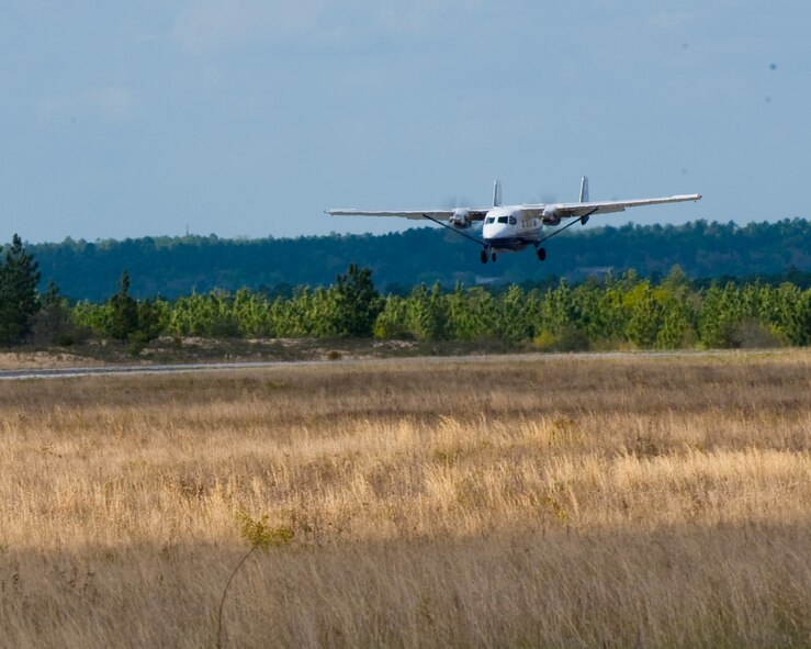 A 6th Special Operations Squadron C-145A aircraft lands on Camp James E. Rudder, April 10, 2013. The aircraft transported service members from various branches of the U.S. military to a safe altitude where they performed the first free fall exercise from a C-145A aircraft. (U.S. Air Force photo/ Staff Sgt. John Bainter)