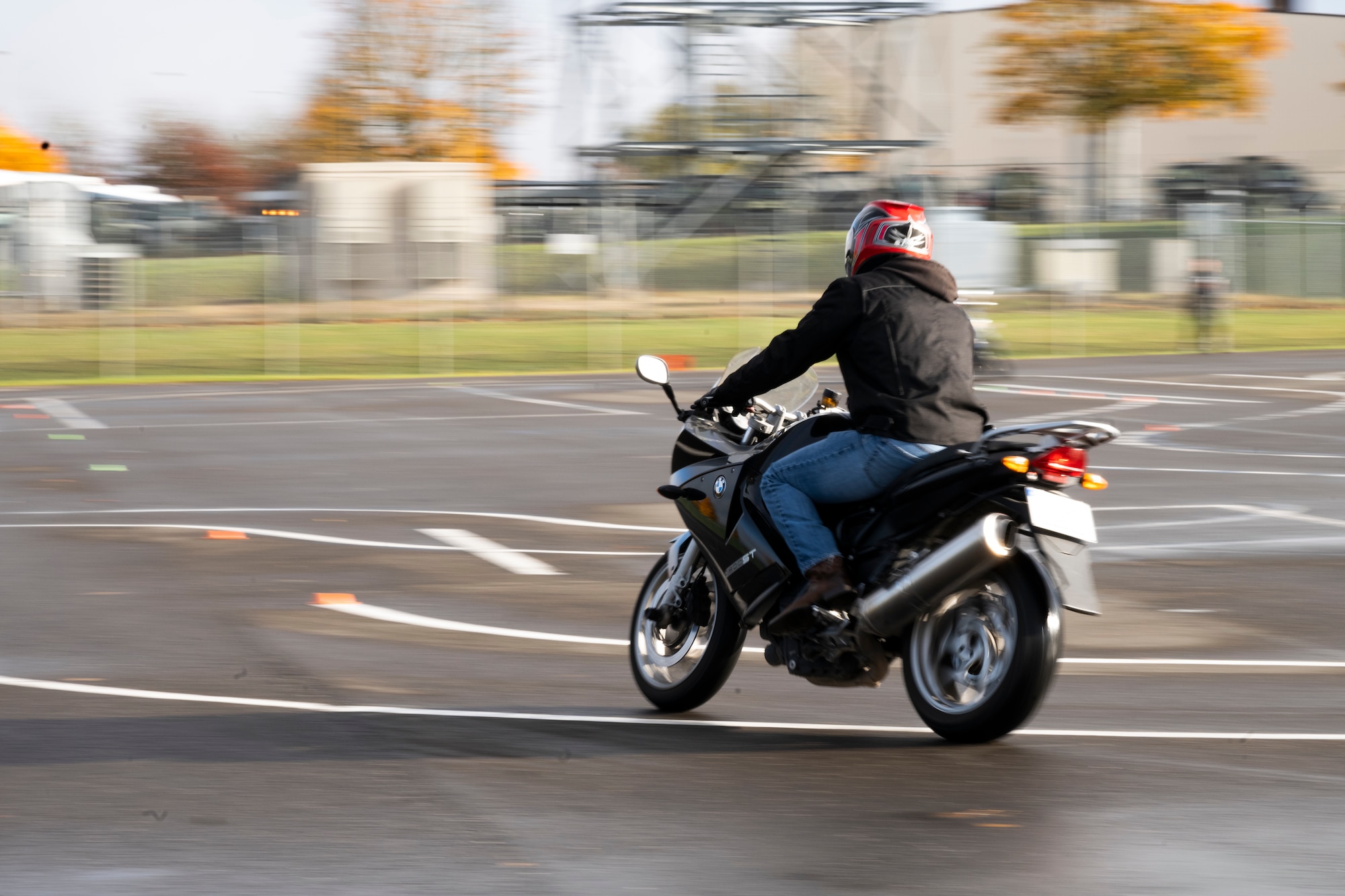 A prospective rider coach in the Motorcycle Safety Foundation Rider Coach Trainer course rides a motorcycle through a paved obstacle course on Spangdahlem Air Base, Germany, Oct. 22, 2021. Motorcycle safety is a top priority for Air Force members due to the high safety risk of riding, which is a leading cause of death among U.S. military members. (U.S. Air Force photo by Senior Airman Ali Stewart)