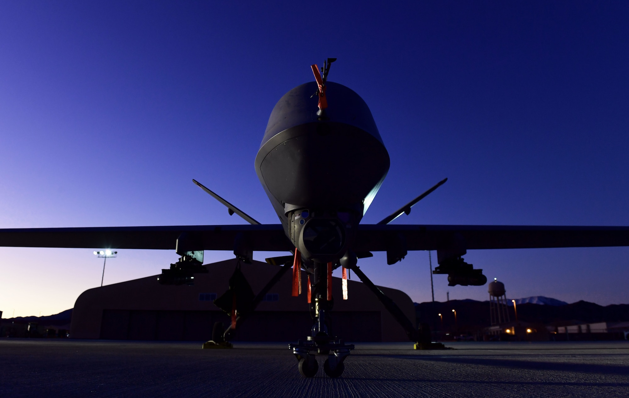 An MQ-9 Reaper sits on the flight line at Creech Air Force Base, Nevada, Dec. 17, 2019. The Remotely Piloted Aircraft enterprise is made of Airmen across all career fields to deliver justice to our Nation’s enemies 24/7/365. (U.S. Air Force photo by Senior Airman Haley Stevens)