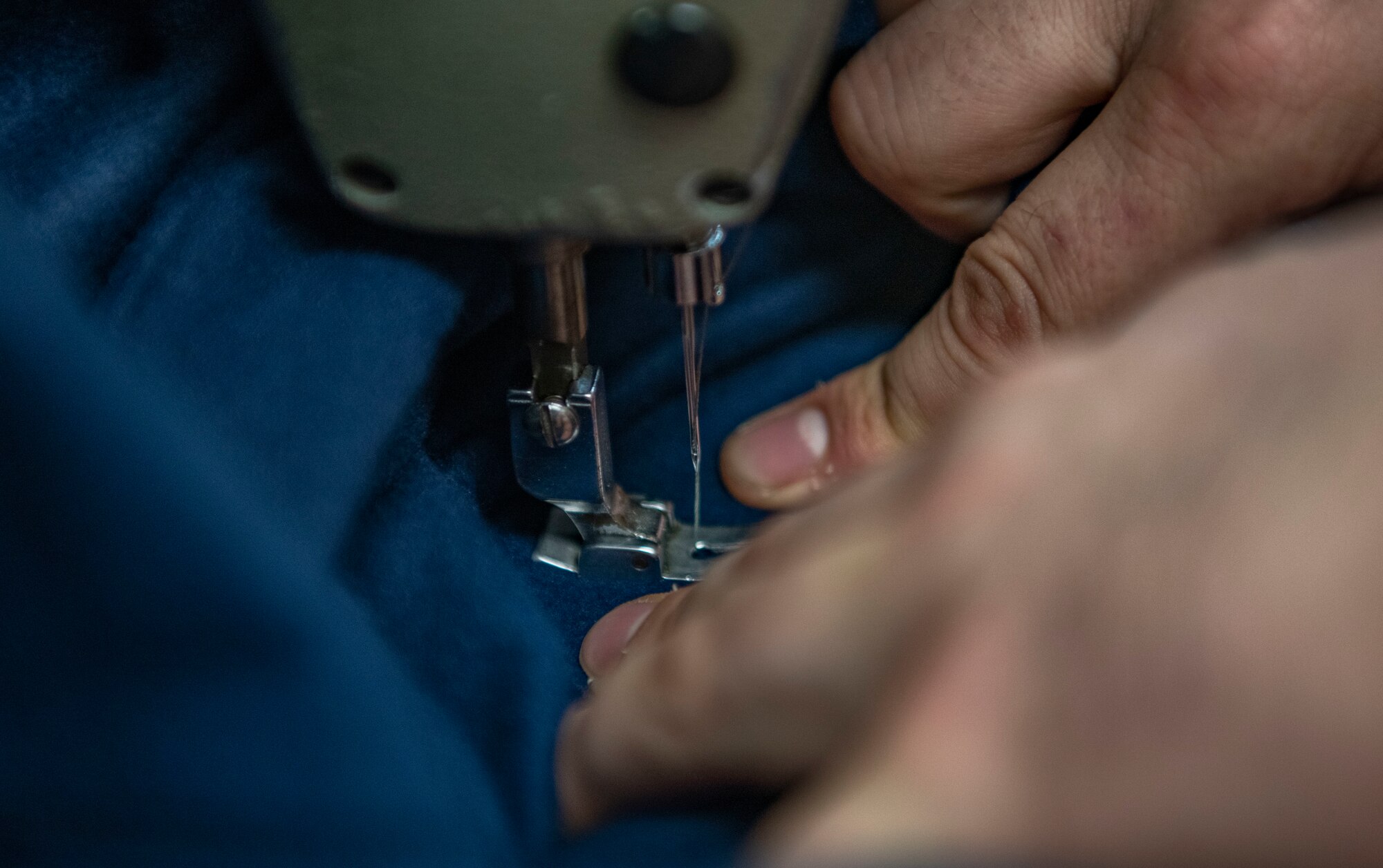 Senior Airman Martin Coetzee, 8th Operation Support Squadron aircrew flight equipment technician, sews an anti-exposure flight dry suit at Kunsan Air Base, Republic of Korea, Nov. 8, 2021. From packing emergency items like parachutes and survival kits to maintaining regularly used items like oxygen masks, the attention to detail by these Airmen could mean the difference between life and death. (U.S. Air Force photo Staff Sgt. Jesenia Landaverde)
