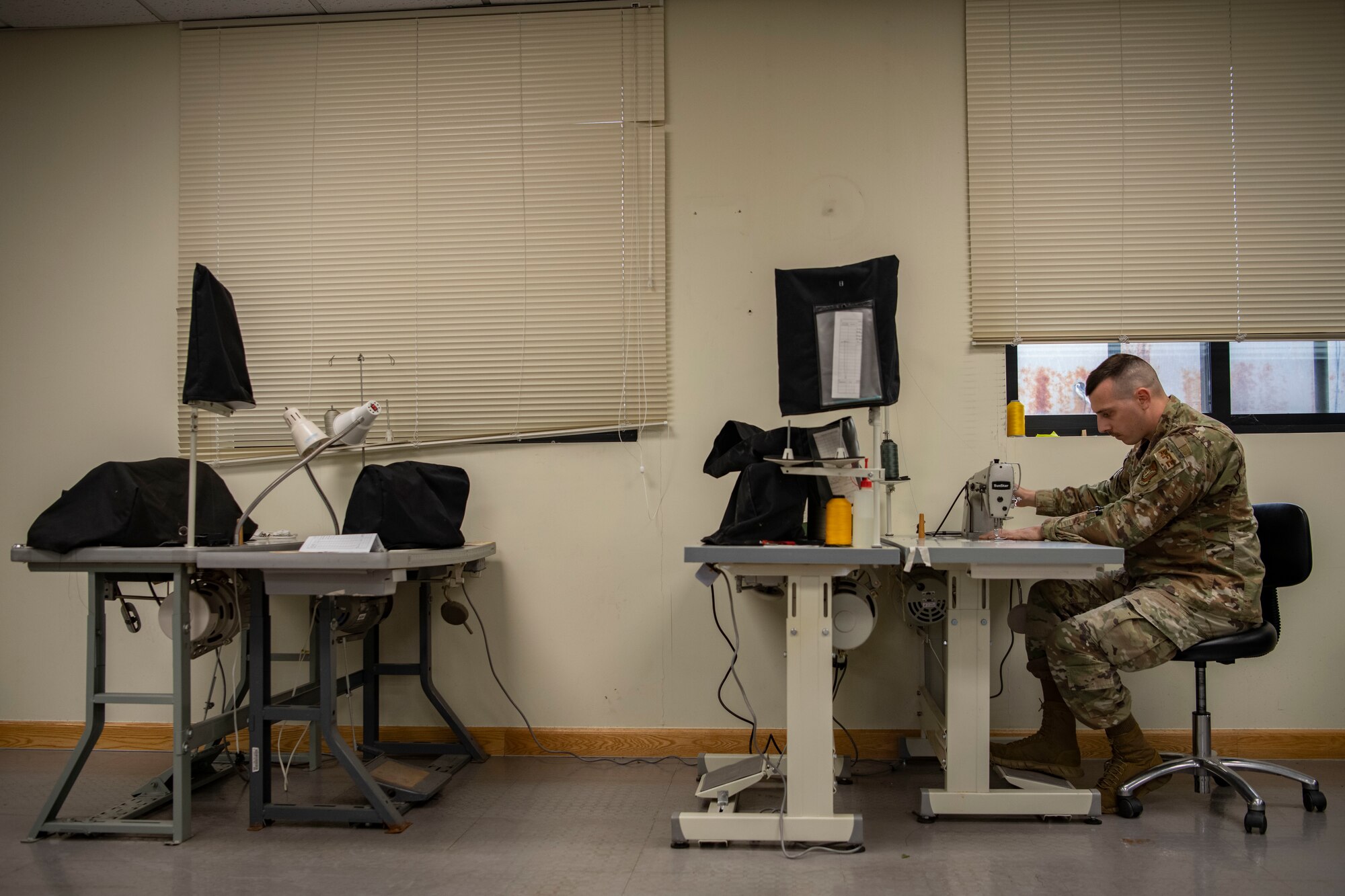 Senior Airman Joseph Crestik, 8th Operation Support Squadron aircrew flight equipment technician, sews a locking loop at Kunsan Air Base, Republic of Korea, Nov. 8, 2021. Aircrew Flight Equipment specialists make sure flyers have the supplies necessary for ensuring that all flight and safety equipment is in the perfect working order. (U.S. Air Force photo Staff Sgt. Jesenia Landaverde)