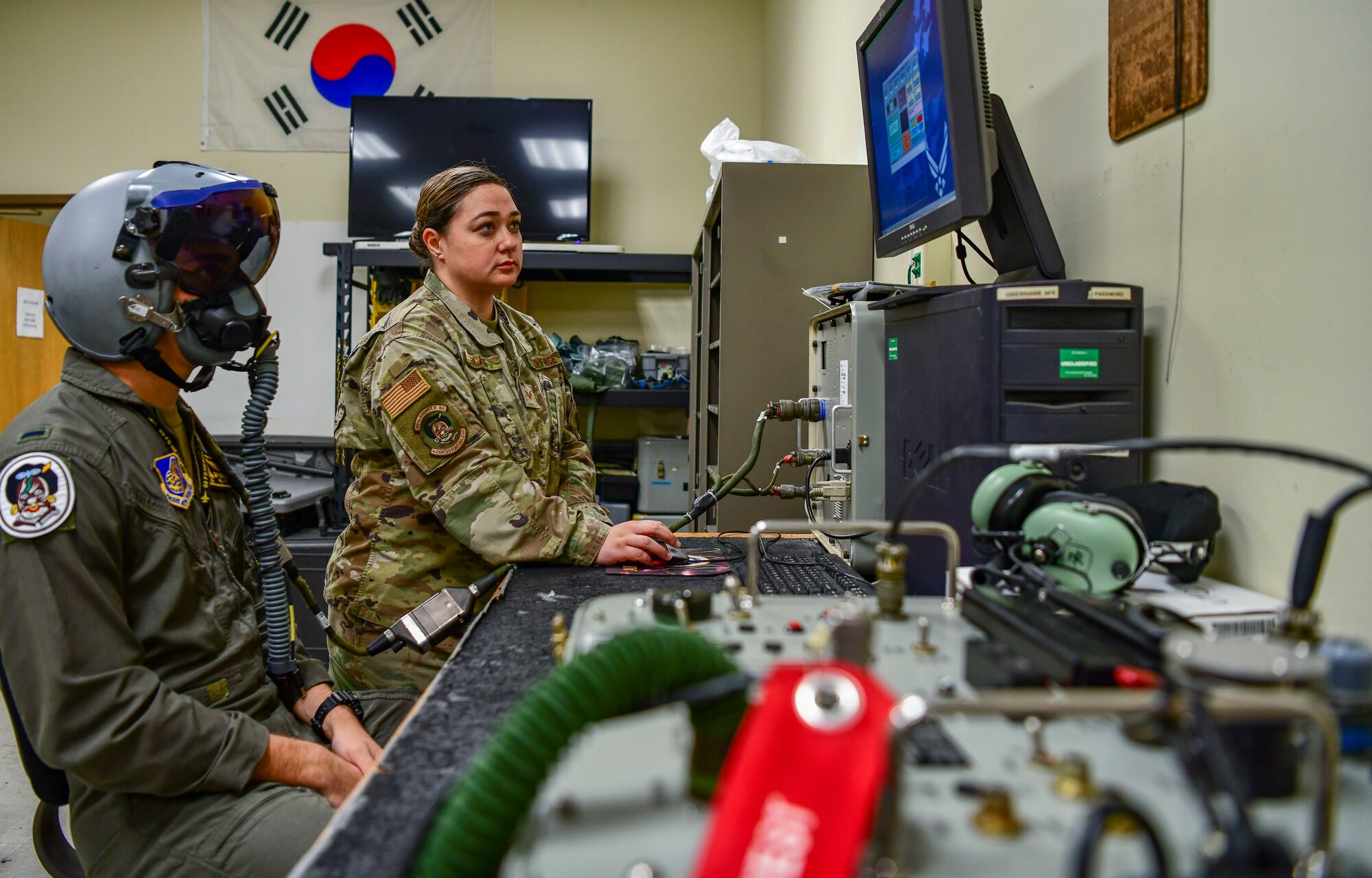 Staff Sgt. Elissa Black, 80th Fighter Squadron aircrew fright equipment noncommissioned officer in charge, calibrates a joint helmet mounted hueing system at Kunsan Air Base, Republic of Korea, Nov. 8, 2021. From packing emergency items like parachutes and survival kits to maintaining regularly used items like oxygen masks, the attention to detail by these Airmen could mean the difference between life and death. (U.S. Air Force photo Staff Sgt. Jesenia Landaverde)
