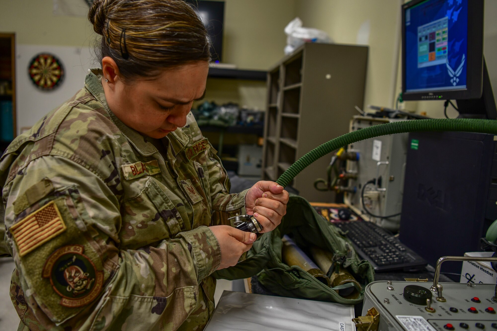 Staff Sgt. Elissa Black, 80th Fighter Squadron aircrew fright equipment noncommissioned officer in charge, tests the effectiveness of a flight suit at Kunsan Air Base, Republic of Korea, Nov. 8, 2021. From packing emergency items like parachutes and survival kits to maintaining regularly used items like oxygen masks, the attention to detail by these Airmen could mean the difference between life and death. (U.S. Air Force photo Staff Sgt. Jesenia Landaverde)
