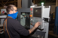 Mechanical Group (Code 930) Production Inside Machine Shop Machinist Shawn Martin uses computer numerical control (CNC) machining to complete daily machining operations. CNC machining is a manufacturing process in which pre-programmed computer software dictates the movement of factory tools and machinery such as grinders, lathes, mills and CNC routers.