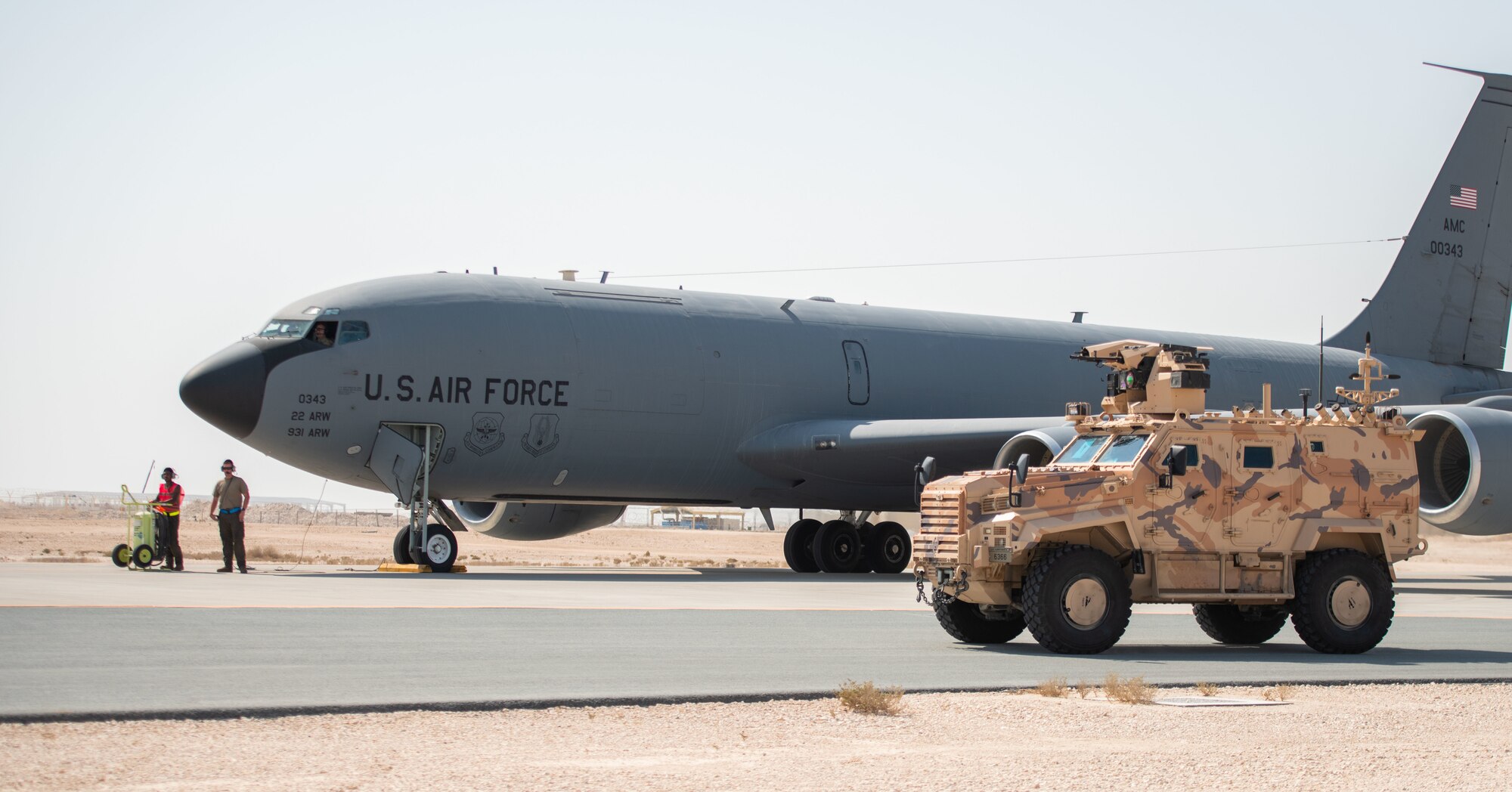 Qatari Emiri Air Force vehicle parked near aircraft for security.
