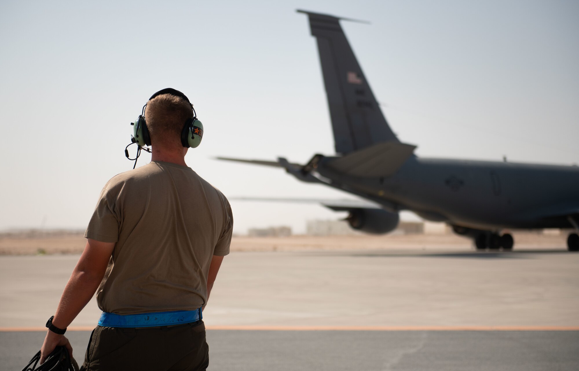 U.S. Air Force Airman watches over an aircraft.