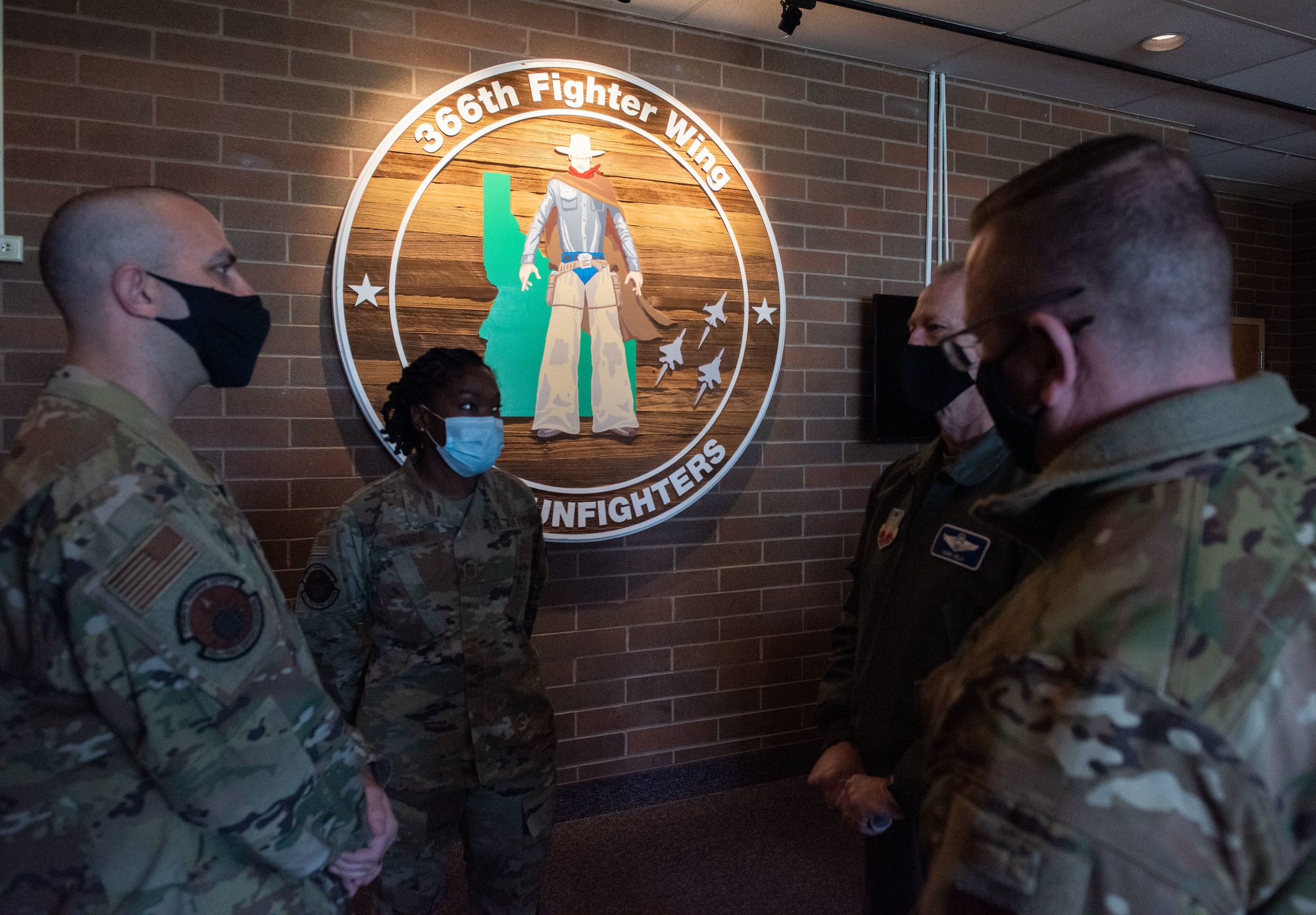 U.S. Air Force Master Sgt. Schwan Moses, with the 366th Force Support Squadron, briefs Gen. Mark Kelly, commander of Air Combat Command, and Command Chief Master Sgt. David Wade, Air Combat Command, during a visit on Mountain Home Air Force Base, Idaho, Nov. 8, 2021. The visit illustrated the Gunfighters priorities and initiatives aimed at modernizing to become the force we need.