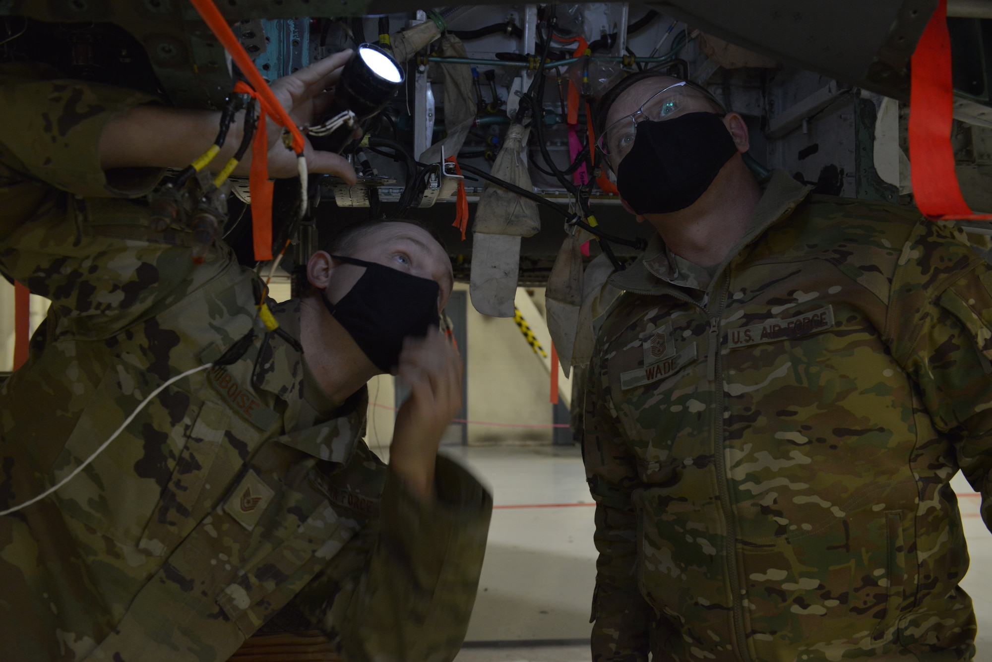 U.S. Air Force Tech. Sgt. Aaron Duboise, left, 366th Maintenance Squadron aircraft structural maintenance shift supervisor, shows Command Chief Master Sgt. David Wade, Air Combat Command, an F-15E Strike Eagle undergoing maintenance on Mountain Home Air Force Base, Idaho, Nov. 9, 2021. The visit illustrated the Gunfighters priorities and initiatives aimed at modernizing to become the force we need