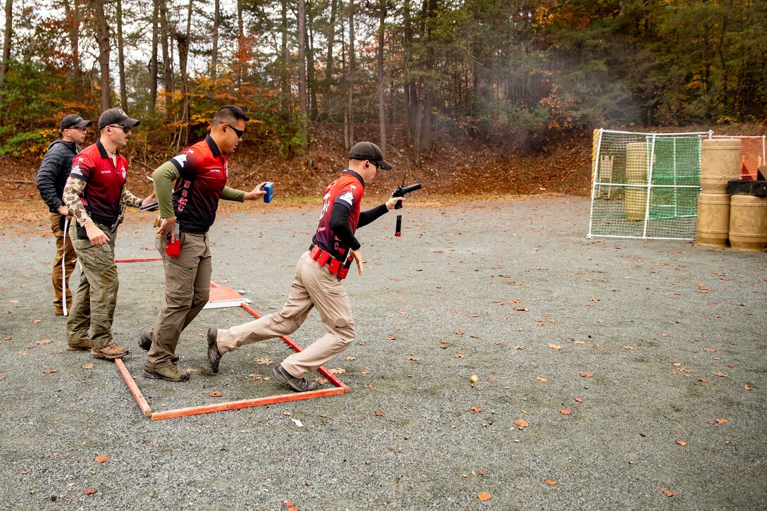 U.S. Marine Corps Sgt. John Treat II, a member of the Marine Corps Action Shooting Team, sprints to his next shooting position at Weapons Training Battalion, on Marine Corps Base Quantico, Va., Nov. 13.  Marines with the Marine Corps Shooting Team compete at the United States Practical Shooting Association match where they are tested in four stages, each with challenges that are different from the last.
