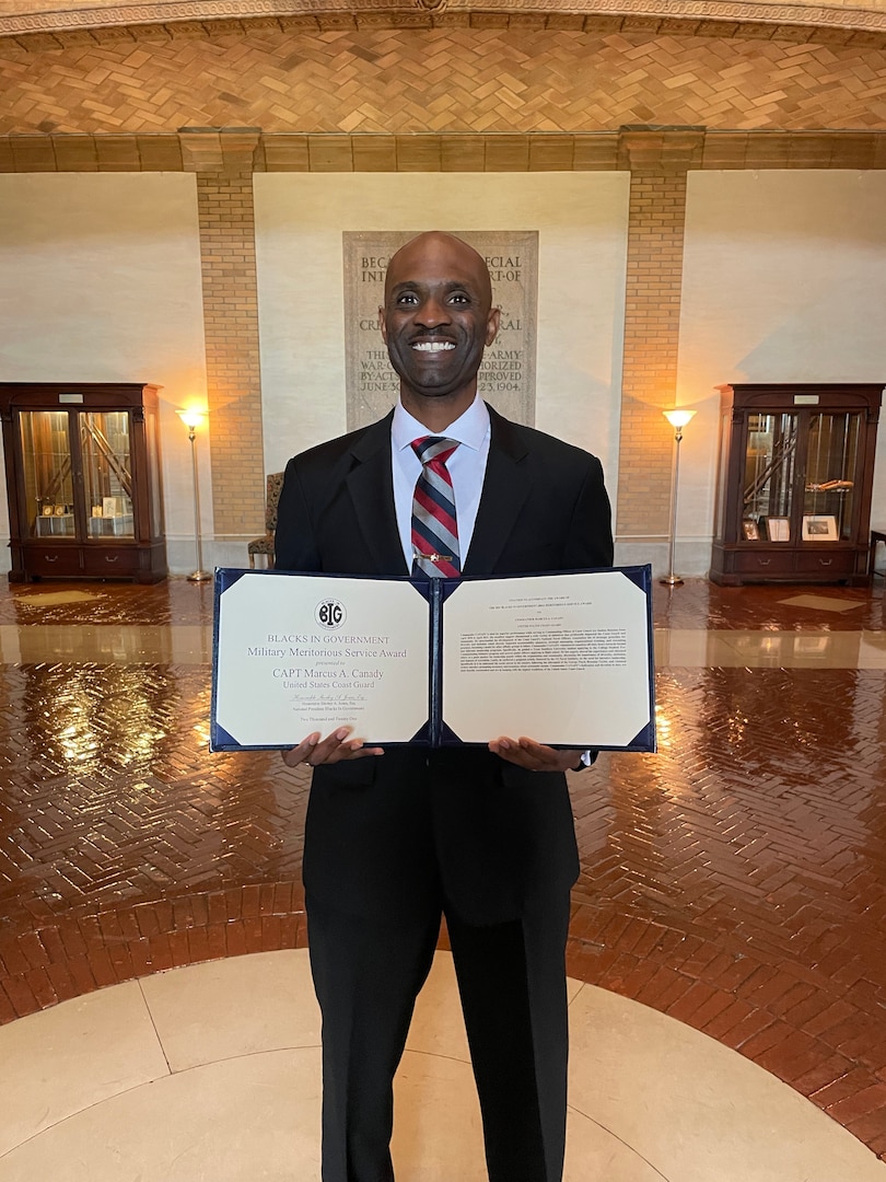 Capt. Marcus Canady, commanding officer of Coast Guard Air Station Houston holds his 2021 Blacks in Government Military Meritorious Service Award certificate on Nov. 8, 2021, at the National Defense University in Washington, D.C. Photo courtesy of Capt. Marcus Canady.