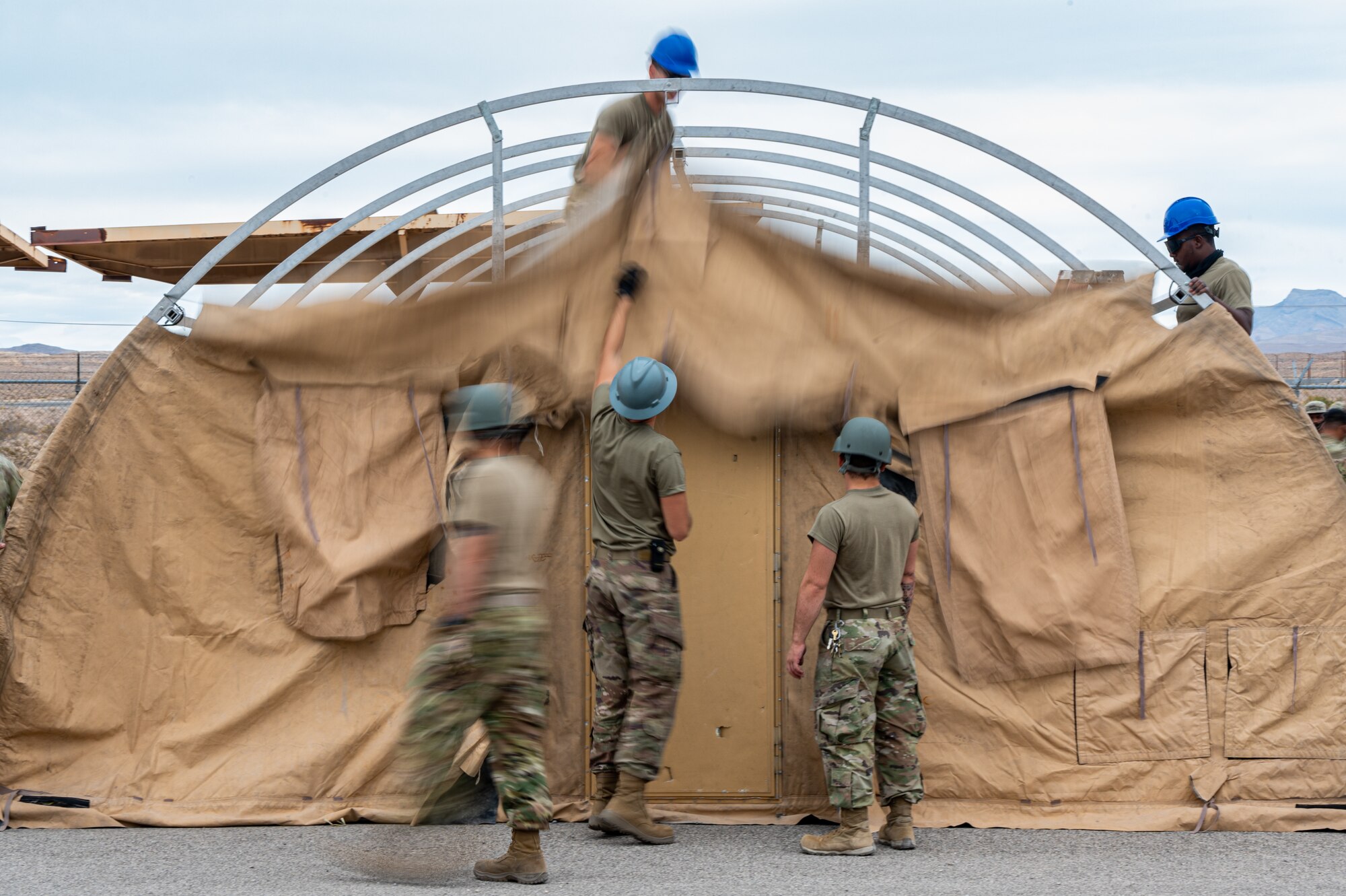 Airmen build a tent