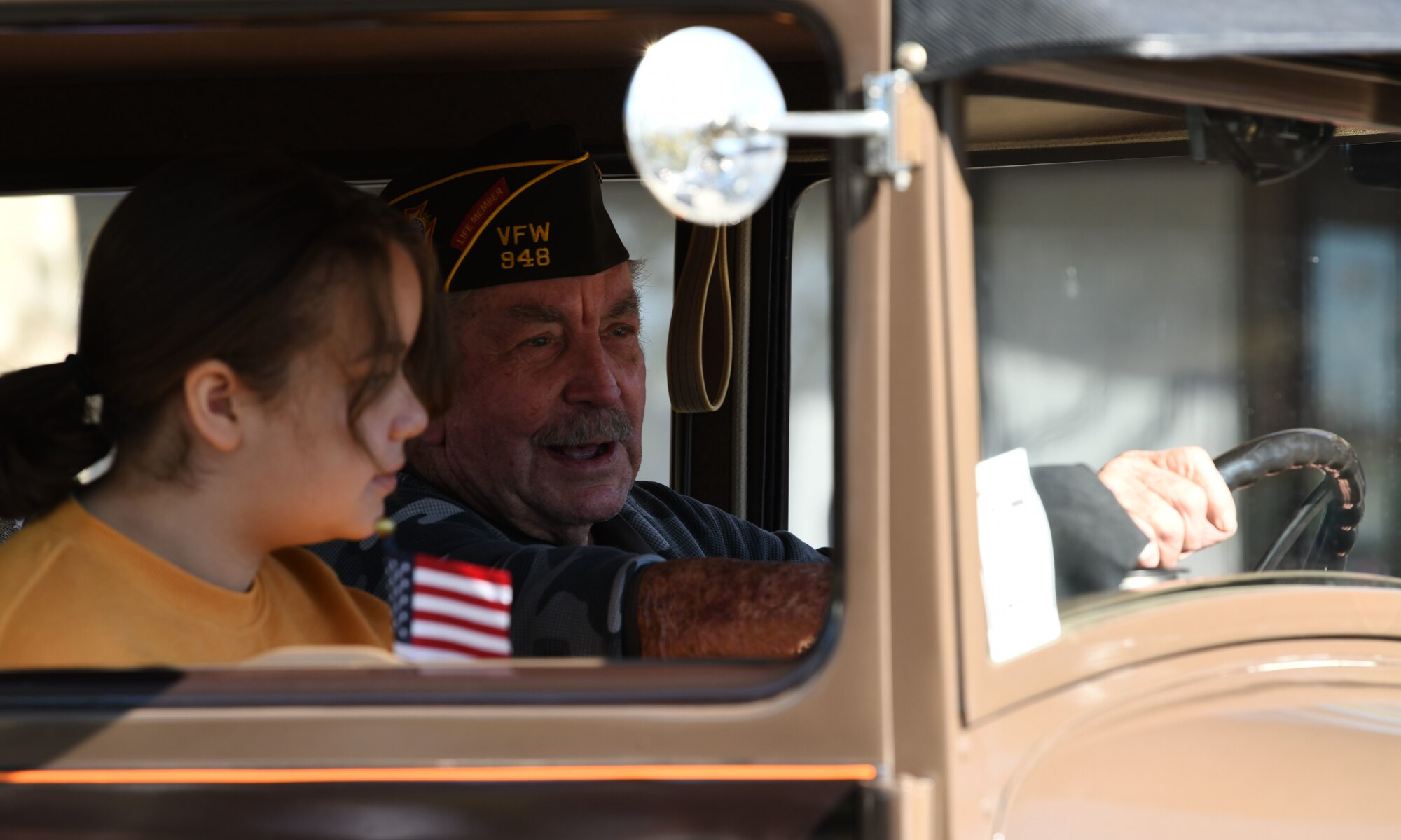 A veteran drives in a Veterans Day Parade Nov. 11, 2021, in Marysville, California.