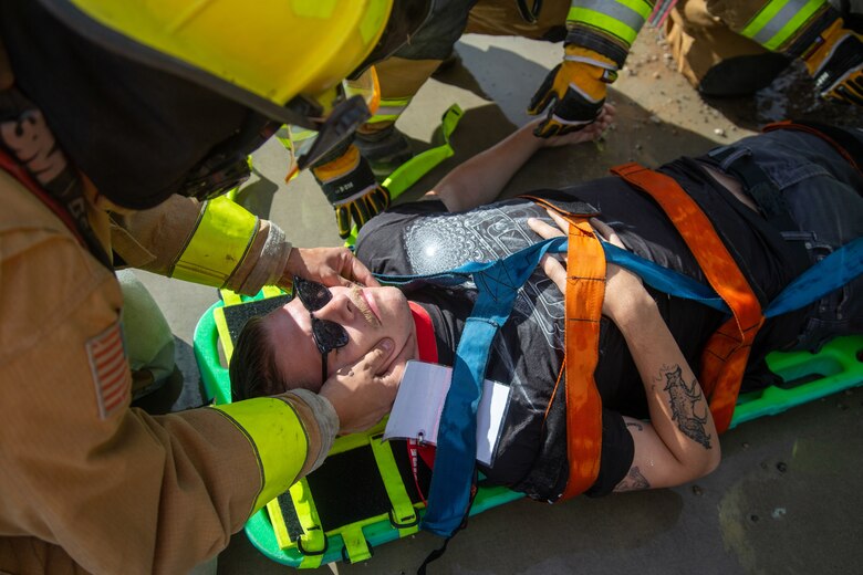 Fire Fighters with Marine Corps Air Station (MCAS) Yuma, Ariz. perform life saving techniques on a simulated casualty during exercise Desert Plume, Nov. 2, 2021. Desert Plume is a training event that evaluates MCAS Yuma’s ability to respond to a CBRNE/HAZMAT incident quickly and efficiently. (U.S. Marine Corps photo by Cpl. Gabrielle Sanders)