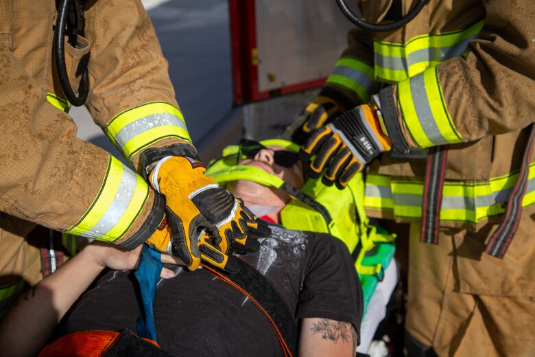 Fire Fighters with Marine Corps Air Station (MCAS) Yuma, Ariz. perform life saving techniques on a simulated casualty during exercise Desert Plume, Nov. 2, 2021. Desert Plume is a training event that evaluates MCAS Yuma’s ability to respond to a CBRNE/HAZMAT incident quickly and efficiently. (U.S. Marine Corps photo by Cpl. Gabrielle Sanders)