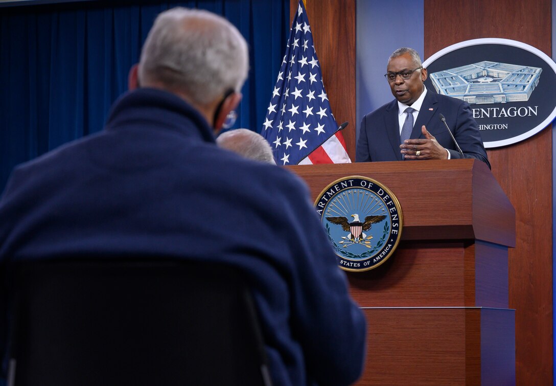 A man speaks from a podium.