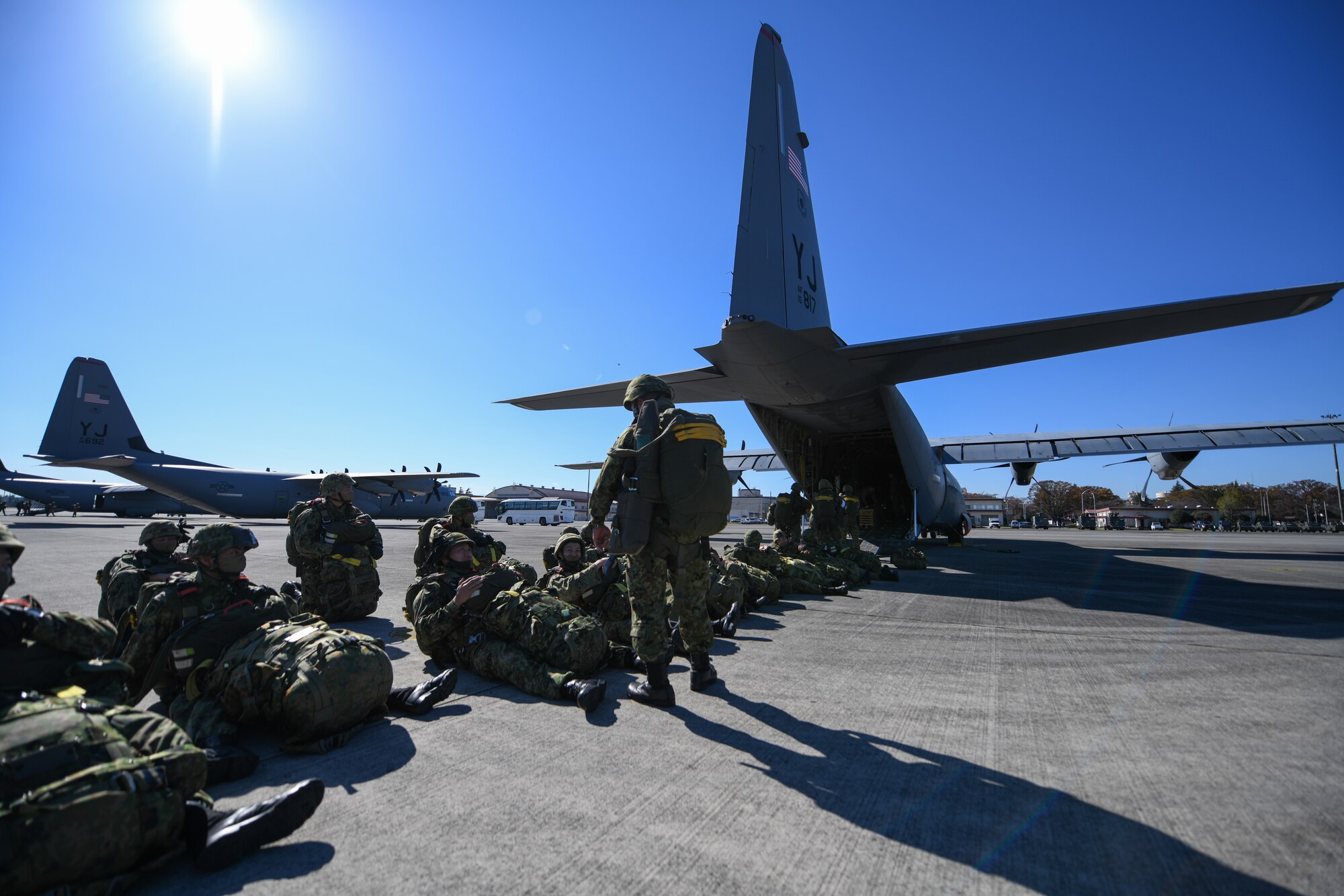 Japan Ground Self-Defense Force soldiers line up outside a C-130J