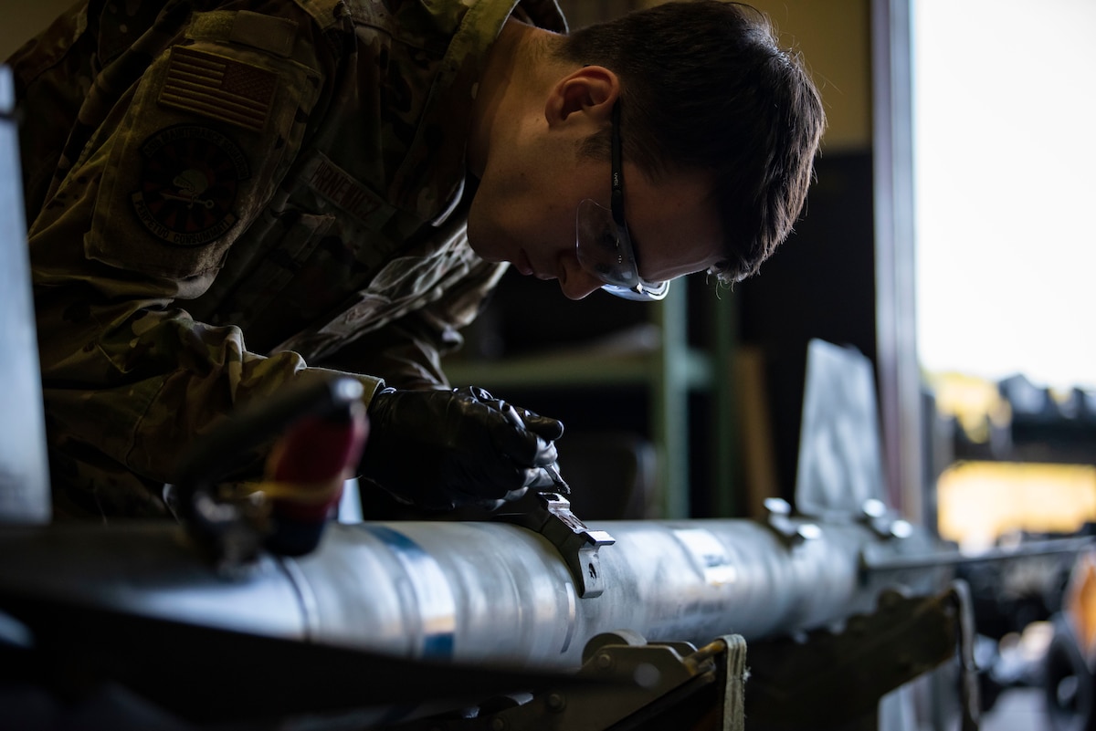 Airman 1st Class Kane Parnewicz, 35th Maintenance Squadron Munitions Flight journeyman, paints an AIM-9 Sidewinder at Misawa Air Base, Japan, Oct. 25, 2021. Parnewicz is a part of a flight that has implemented the Theory of Constraints (TOC). The TOC methodology, not only beneficial to maintenance groups, is being implemented across the Air Force to train Airmen in all career fields on the concept to identify constraints and work to create solutions.