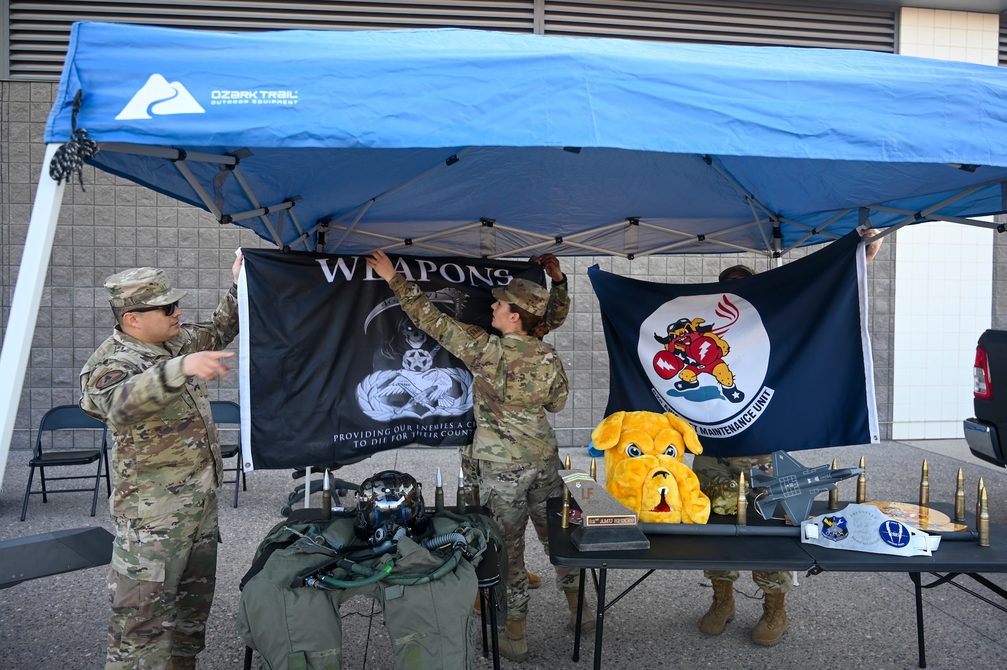 Airmen from the 62nd and 63rd Aircraft Maintenance Units set up their station for a Salute to Service event Nov. 14, 2021, at the State Farm Stadium, Glendale, Arizona.