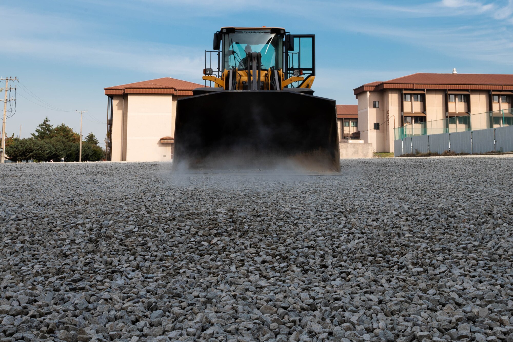 Staff Sgt. Bryan Esqueda, 51st Civil Engineer Squadron pavements and equipment shop Airman, operates a heavy loader at Osan