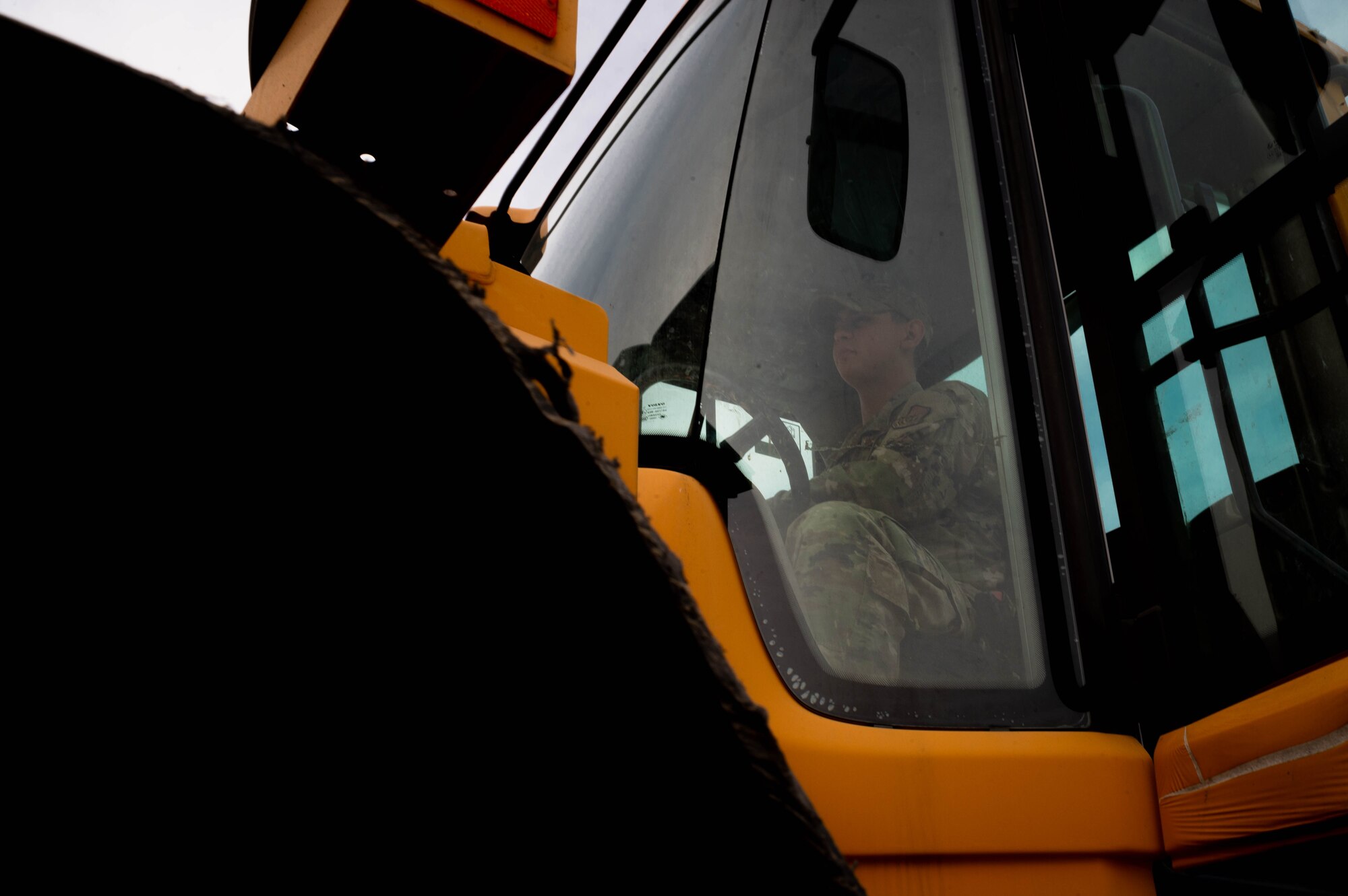 Staff Sgt. Bryan Esqueda, 51st Civil Engineer Squadron pavements and equipment shop Airman, levels gravel for a parking lot at Osan