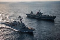 The Blue Ridge-class command and control ship USS Mount Whitney (LCC 20) and Arleigh Burke-class guided missile destroyer USS Porter (DDG 78) render honors in the Black Sea, Nov. 12, 2021.