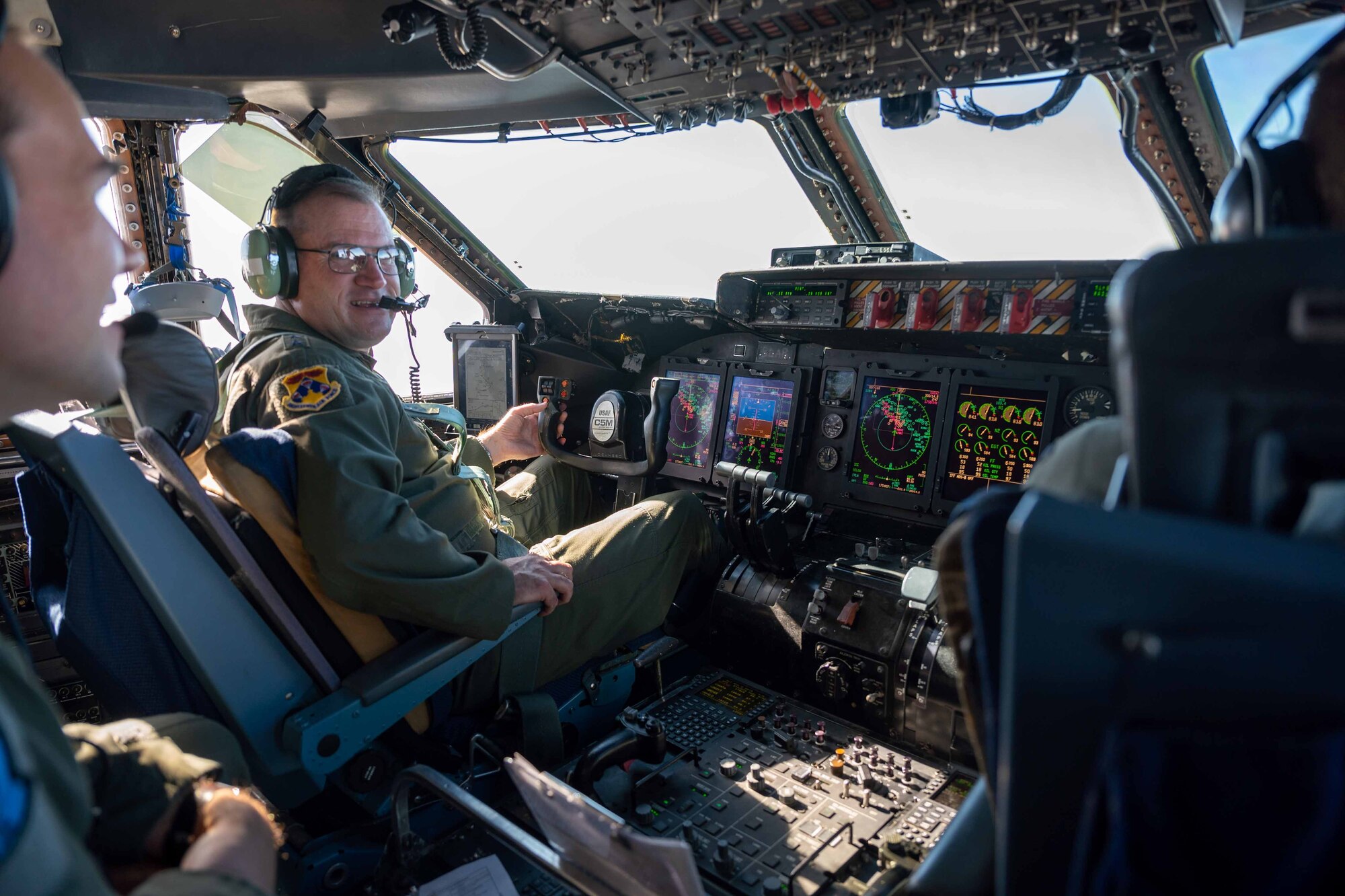 Maj. Gen. Thad Bibb, 18th Air Force commander, flies on a C-5M Super Galaxy during a local training flight over the Atlantic Ocean, Nov. 16, 2021. During his tour, Bibb, who commanded the 9th Airlift Squadron from 2006-2009, is a command pilot with more than 5,000 hours in seven different aircraft. (U.S. Air Force photo by Senior Airman Faith Schaefer)