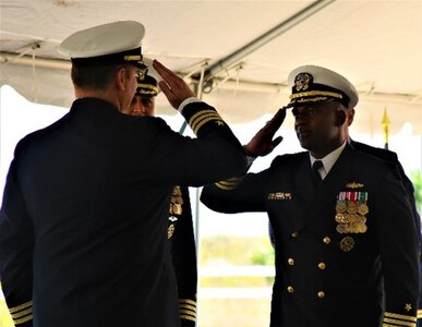 Before Capt. Ken Anderson, commodore, Naval Surface Squadron Fourteen, Cmdr. Brian Anthony, (right), relieves Cmdr. Timothy Shanley, as the new commanding officer aboard USS Winston S. Churchill (DDG 81).