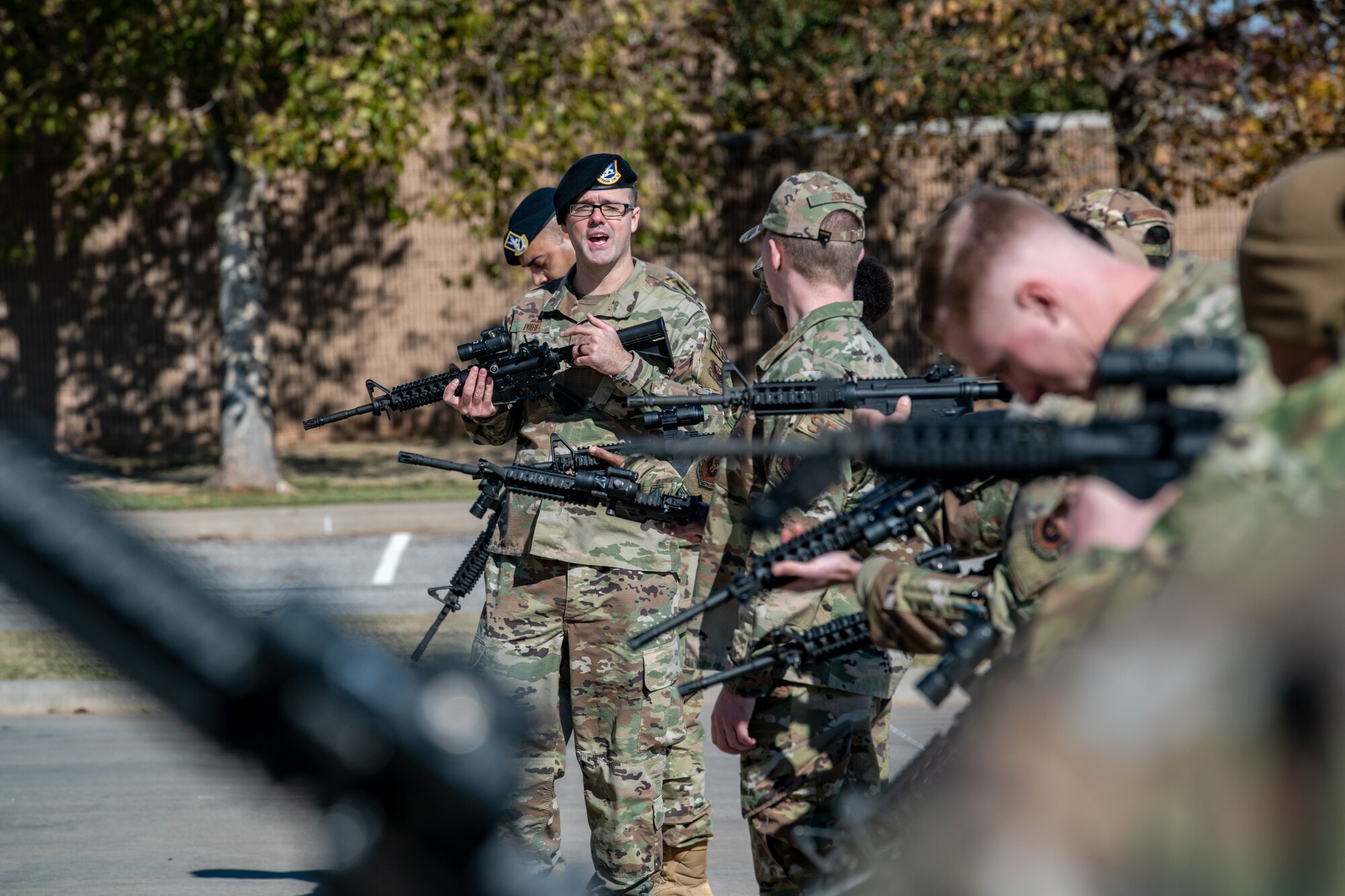 Airmen clear weapons during a training demonstration