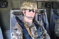 Lt. Col. Thomas Mancino, commander 45th Brigade Special Troops Battalion, 45th Infantry Brigade Combat Team, rides in a UH-60 Black Hawk helicopter while deployed to Afghanistan in 2011.