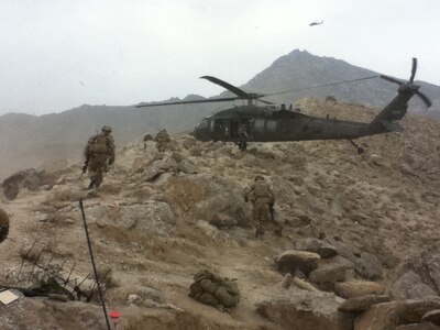 Lt. Col. Thomas H. Mancino and Soldiers assigned to the 45th Infantry Brigade Combat Team load into a UH-60 Black Hawk Helicopter during operations in Afghanistan while deployed there in 2011. Mancino served as the commander of the 45th Brigade Special Troops Battalion, 45th Infantry Brigade Combat Team.