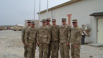 Lt. Col. Thomas H. Mancino poses with Soldiers in Afghanistan while deployed there in 2011 as the commander of the 45th Brigade Special Troops Battalion, 45th Infantry Brigade Combat Team.