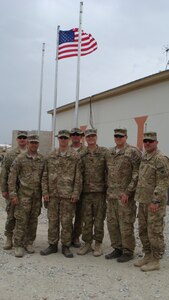 Lt. Col. Thomas H. Mancino poses with Soldiers in Afghanistan while deployed there in 2011 as the commander of the 45th Brigade Special Troops Battalion, 45th Infantry Brigade Combat Team.