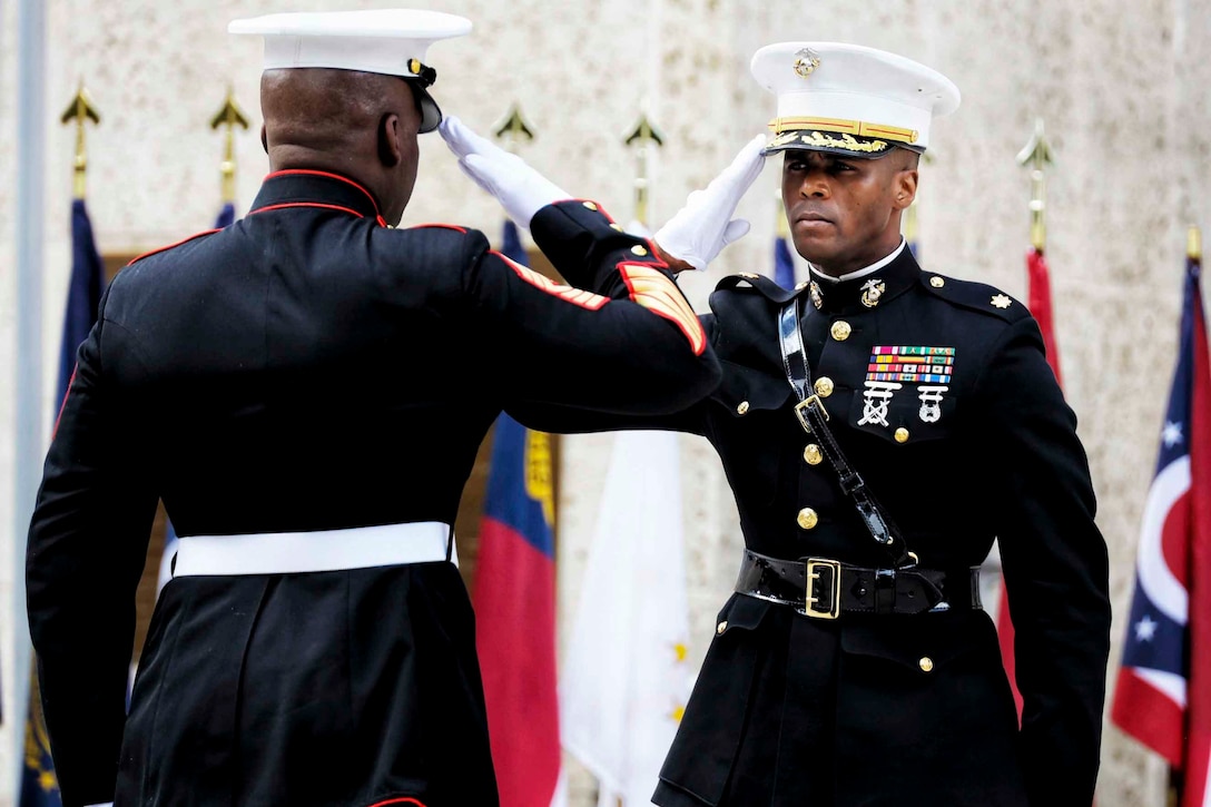 A Marine salutes another Marine.