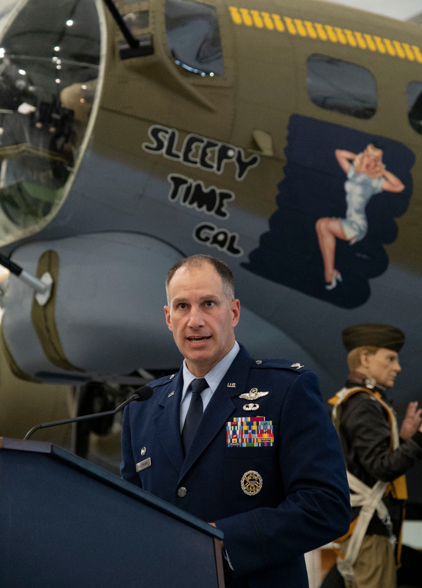 Col. Matt Husemann, 436th Airlift Wing commander, addresses attendees after the unveiling of the Chair of Honor display at the Air Mobility Command Museum on Dover Air Force Base, Delaware, Nov. 11, 2021. The aircraft chair is one of 58 dedicated chairs of honor throughout the state of Delaware and the first aircraft chair. (U.S. Air Force photo by Roland Balik)