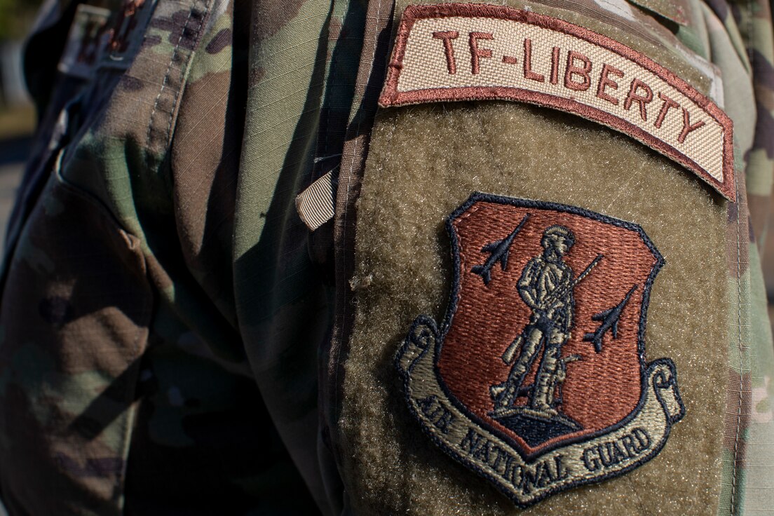 U.S. Air Force Col. Bernadette Maldonado shows off her Task Force-Liberty patch on Joint Base McGuire-Dix-Lakehurst, N.J., Nov. 8, 2021