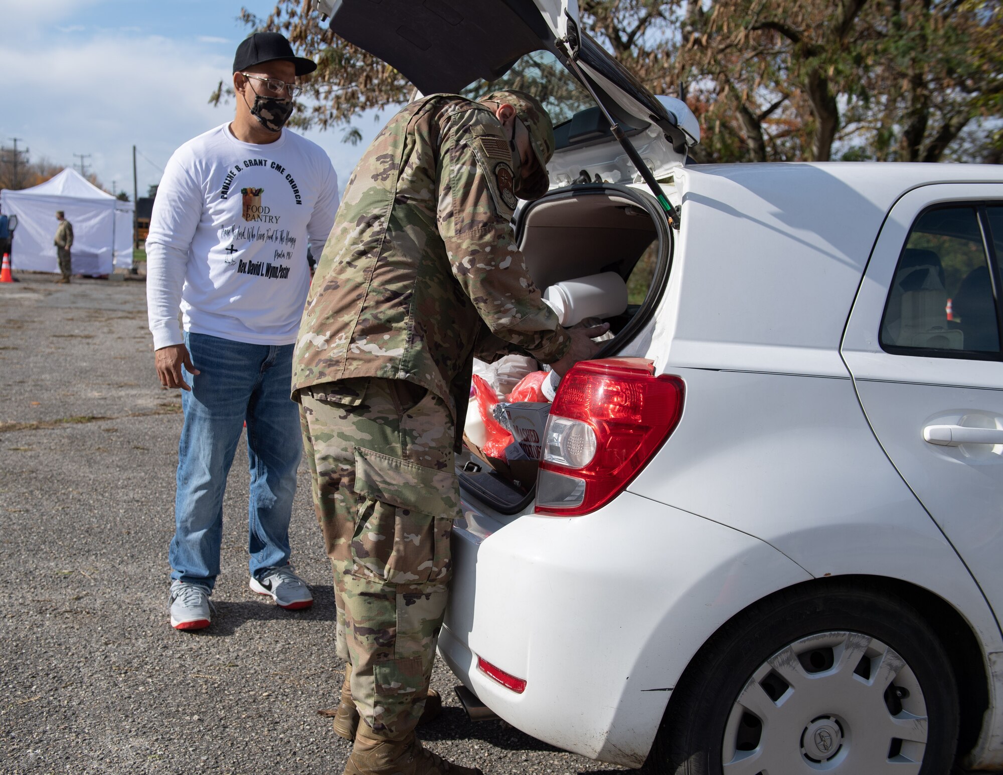 First Sergeants from the 514th Air Mobility Wing, sort and distribute food during a food distribution event in Pemberton, N.J., November 13, 2021.