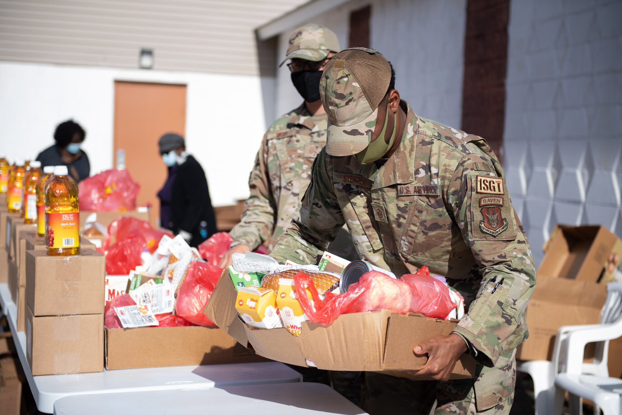 First Sergeants from the 514th Air Mobility Wing, sort and distribute food during a food distribution event in Pemberton, N.J., November 13, 2021.