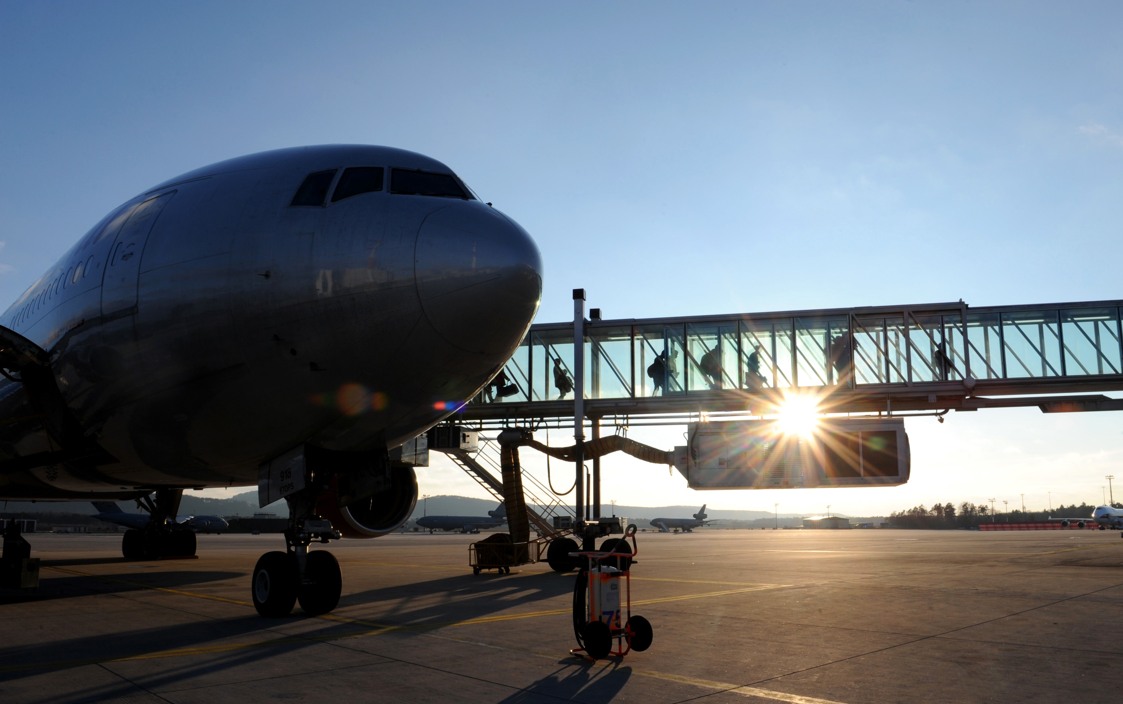 Passengers arriving from Baltimore-Washington International Airport depart an aircraft upon arrival at the Passenger Terminal at Ramstein Air Base, Germany, Feb. 4, 2015. The passenger terminal serves more than 13,000 passengers in an average month. (U.S. Air Force Photo/Airman 1st Class Michael Stuart)