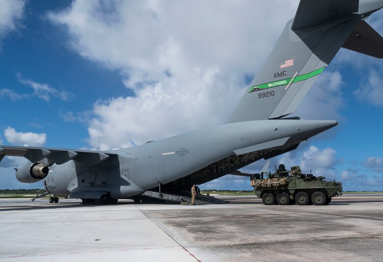 U.S. Air Force Airmen with the 62nd Airlift Wing loads a U.S. Army Stryker into a C-17 Globemaster III during Exercise Rainier War 21B at Andersen Air Force Base, Guam, Nov. 9, 2021. Rainier War 21B exercised and evaluated the 62nd Airlift Wing’s ability to employ the force and their ability to perform during wartime and contingency taskings in a high-intensity, wartime contested, degraded and operationally limited environment while supporting the contingency operations against a near-peer adversary in the U.S. Indo-Pacific Command area of responsibility. (U.S. Air Force photo by Staff Sgt. Rachel Williams)