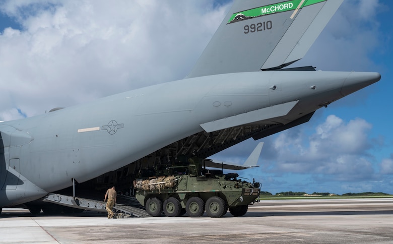U.S. Air Force Airmen with the 62nd Airlift Wing loads a U.S. Army Stryker into a C-17 Globemaster III during Exercise Rainier War 21B at Andersen Air Force Base, Guam, Nov. 9, 2021. Rainier War 21B exercised and evaluated the 62nd Airlift Wing’s ability to employ the force and their ability to perform during wartime and contingency taskings in a high-intensity, wartime contested, degraded and operationally limited environment while supporting the contingency operations against a near-peer adversary in the U.S. Indo-Pacific Command area of responsibility. (U.S. Air Force photo by Staff Sgt. Rachel Williams)