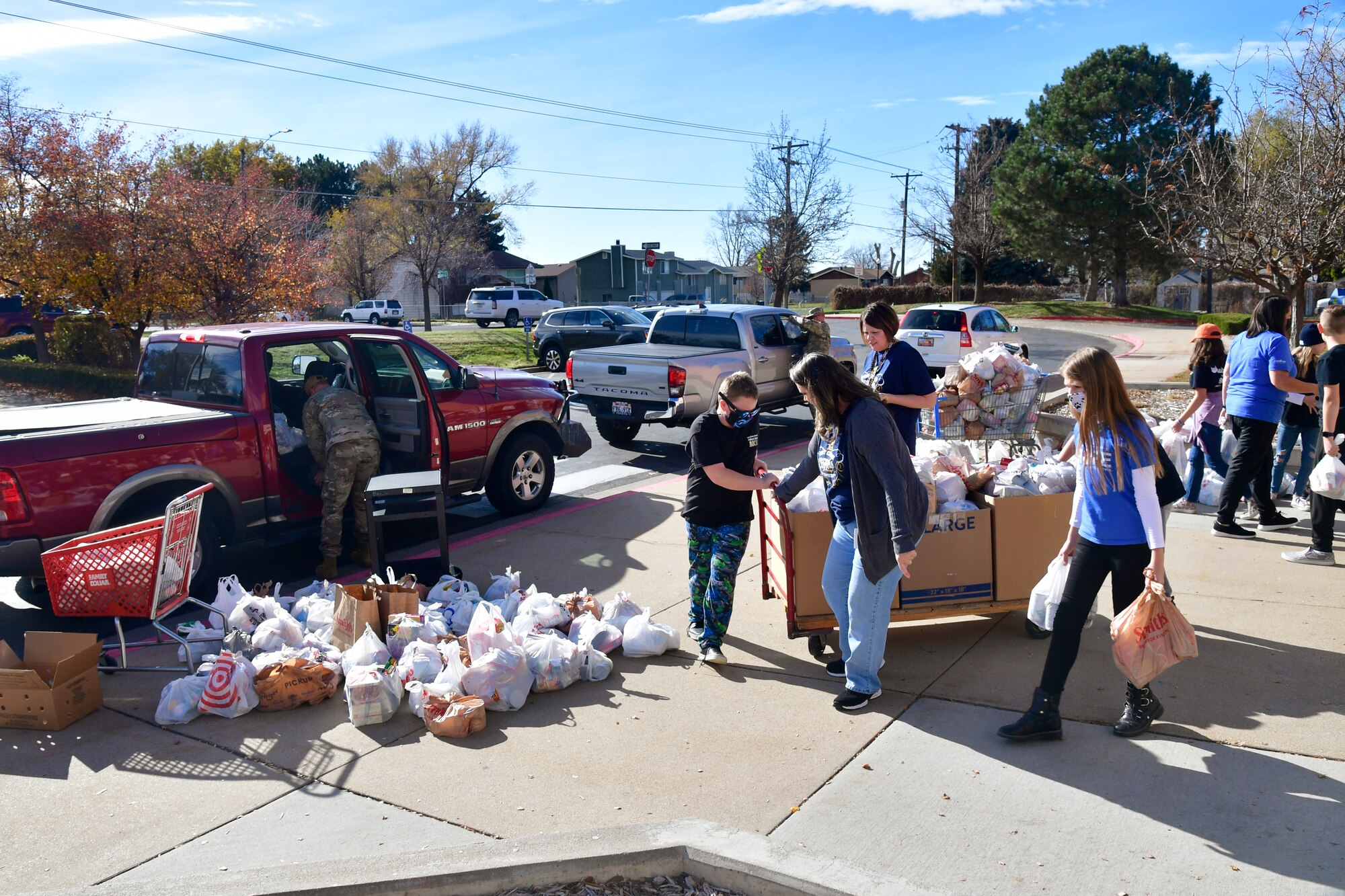 West Clinton Elementary School students and teachers help load food items into a truck.