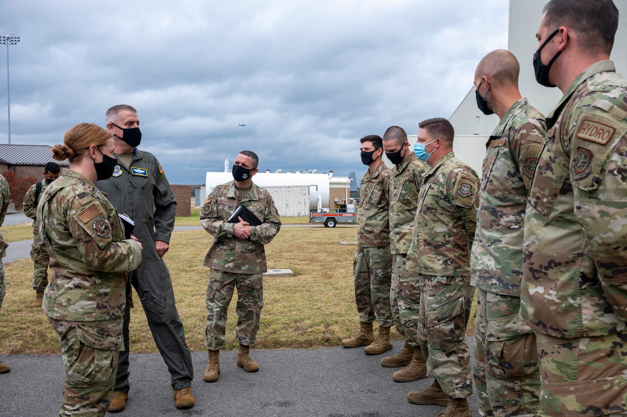 Gen. Minihan speaks with Airmen outside the fuels system repair hangar.