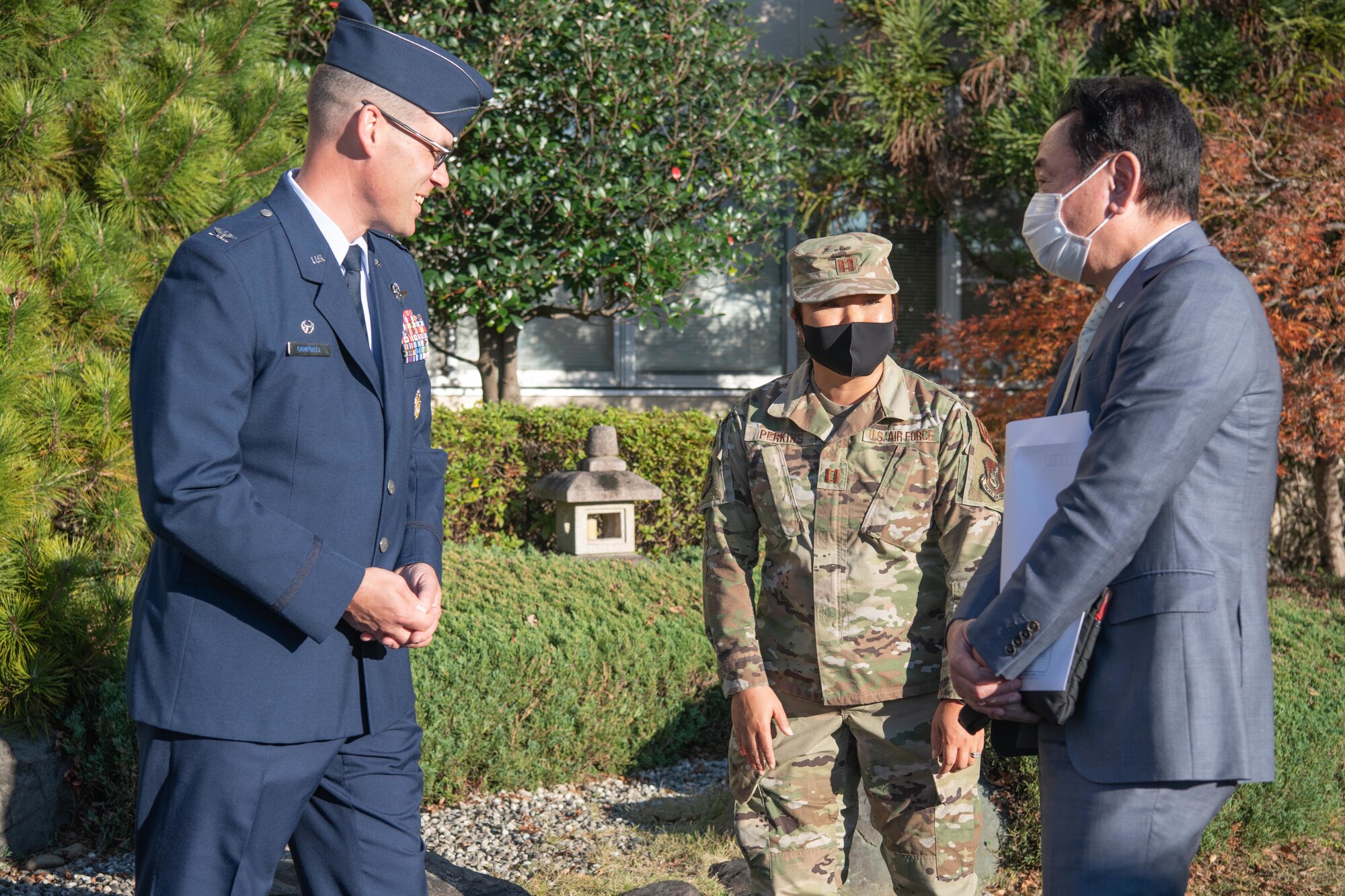 Col. Andrew Campbell, 374th Airlift Wing commander, left, greets Japanese mayors from the Kanto, Tohoku, and Hokkaido regions, who toured Yokota Air Base, Japan, Nov. 15, 2021. The mayors visited Yokota to observe the partnership between the U.S. Air Force and Japan Air Self-Defense Forces, to learn the strategic importance of the 374th Airlift Wing's mission, and its partnership with local communities. (U.S. Air Force photo by Airman 1st Class Brooklyn Golightly)