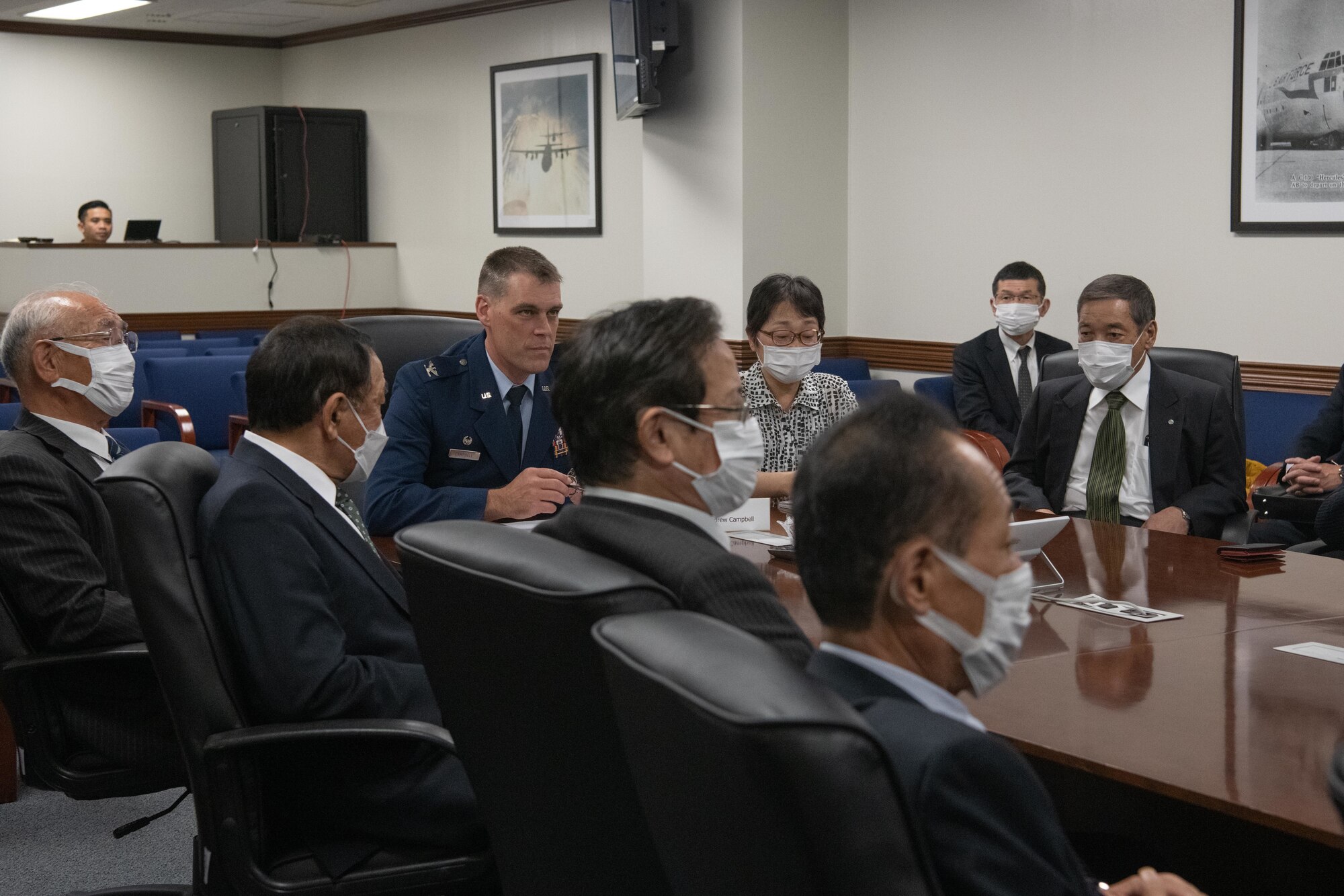 Col. Andrew Campbell, 374th Airlift Wing commander, briefs Japanese mayors from the Kanto, Tohoku, and Hokkaido regions, during a tour of Yokota Air Base, Japan, Nov. 15, 2021. Campbell briefed the importance of the 374th AW's mission to the defense of Japan. (U.S. Air Force photo by Airman 1st Class Brooklyn Golightly)