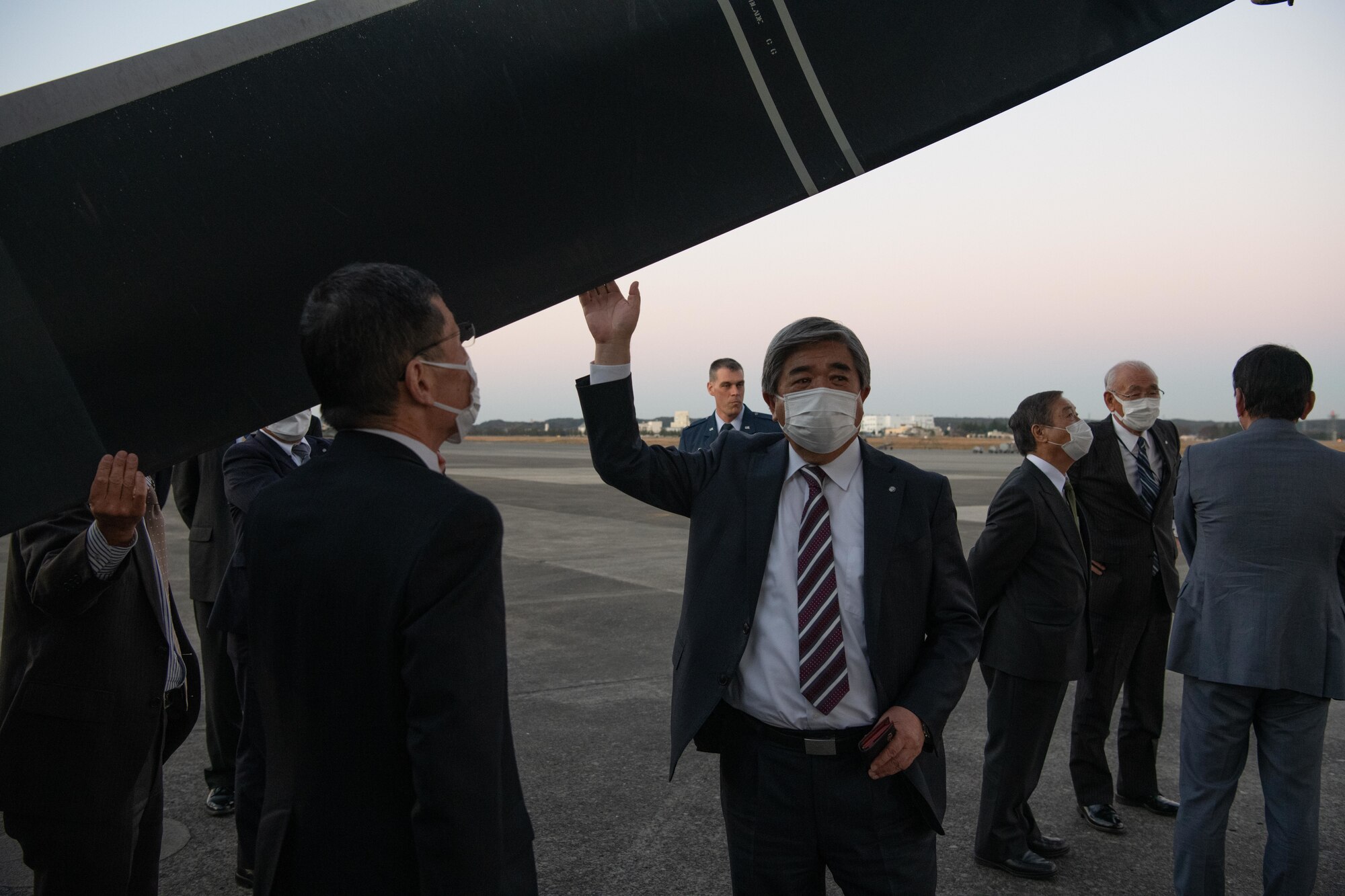 Takao Tanano, Mayor of Shiranuka Town, Hokkaido prefecture studies CV-22 Osprey aircraft blade, during a static display tour at Yokota Air Base, Japan, Nov. 15, 2021. The mayors visited Yokota to observe the partnership between the U.S. Air Force and Japan Air Self-Defense Forces, to learn the strategic importance of the 374th Airlift Wing's mission, and its partnership with local communities. (U.S. Air Force photo by Airman 1st Class Brooklyn Golightly)